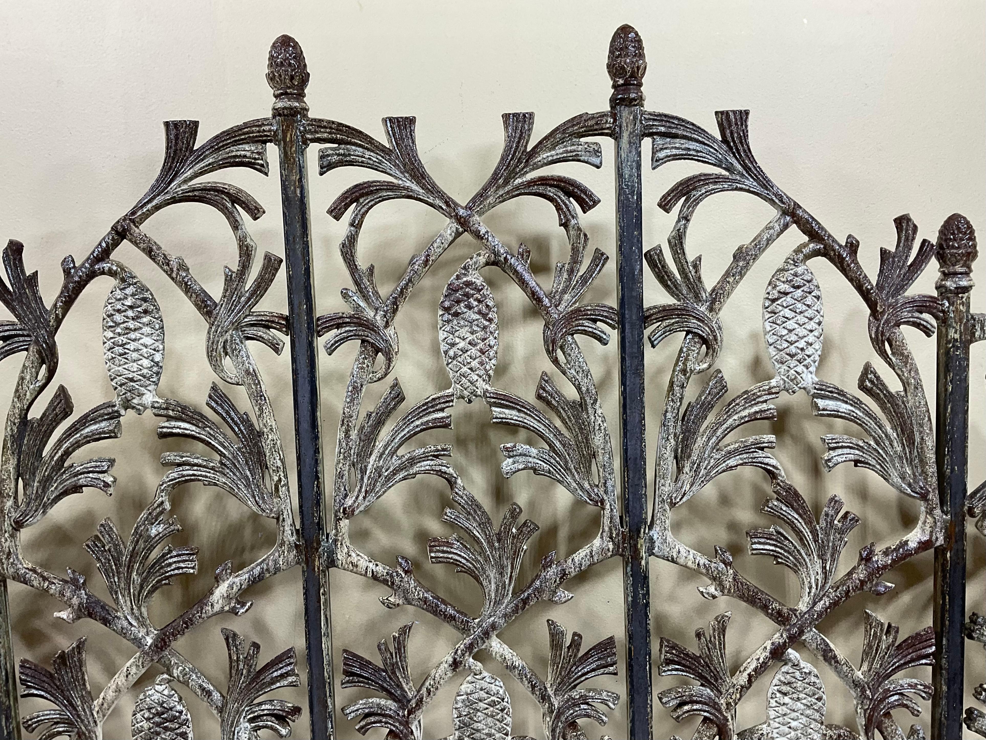 Exceptional fireplace screen made of cast iron with vines and pinecone motifs all around, beautiful snowy patina and rustic on two sides, treated and sealed for rust, great decorative object of art for the fireplace.