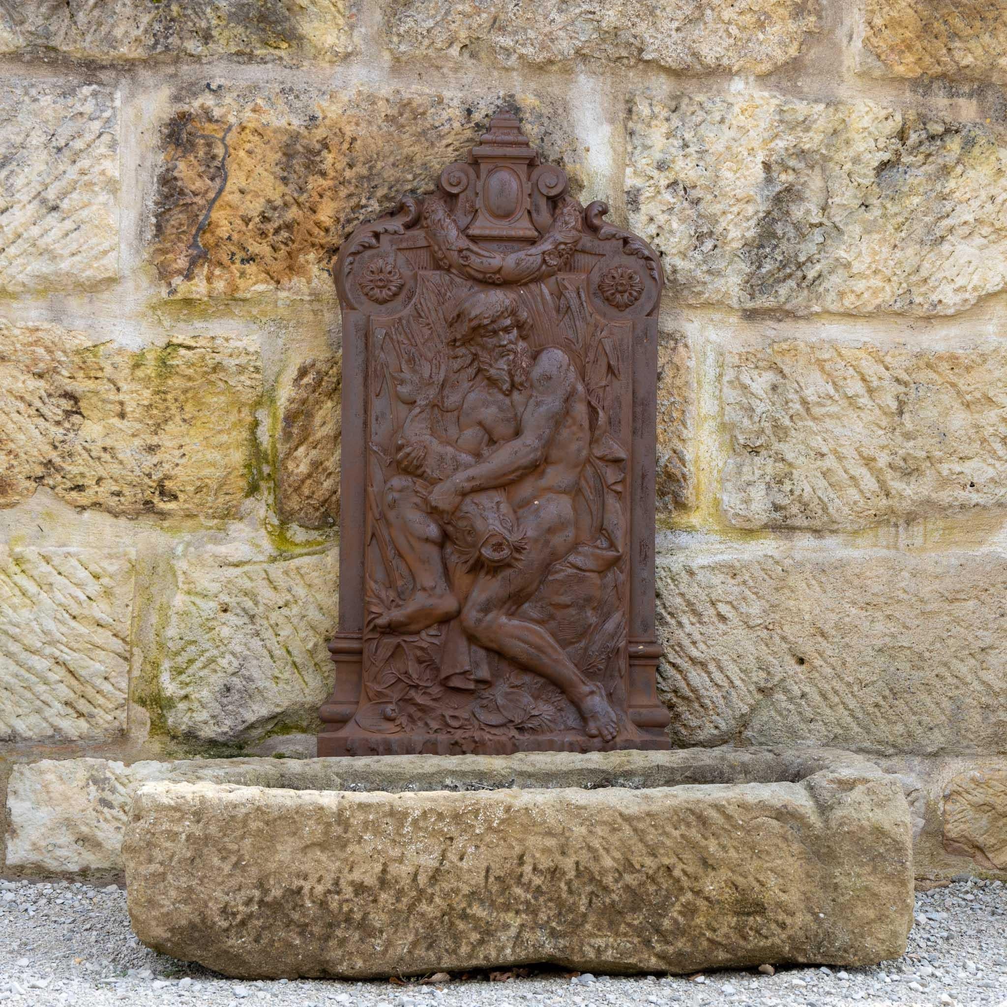 Large relief made of iron with the expressive representation of the Aquarius from the 20th century.