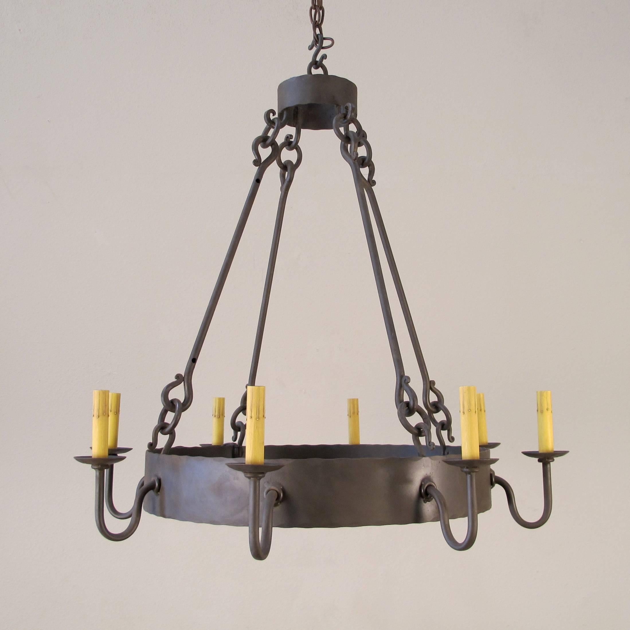 Part of the chandelier product line, this is our Newport Chandelier, Small. Forged iron ring chandelier with 8 candelabra base lights. Made to order. UL Listed and made in California.
