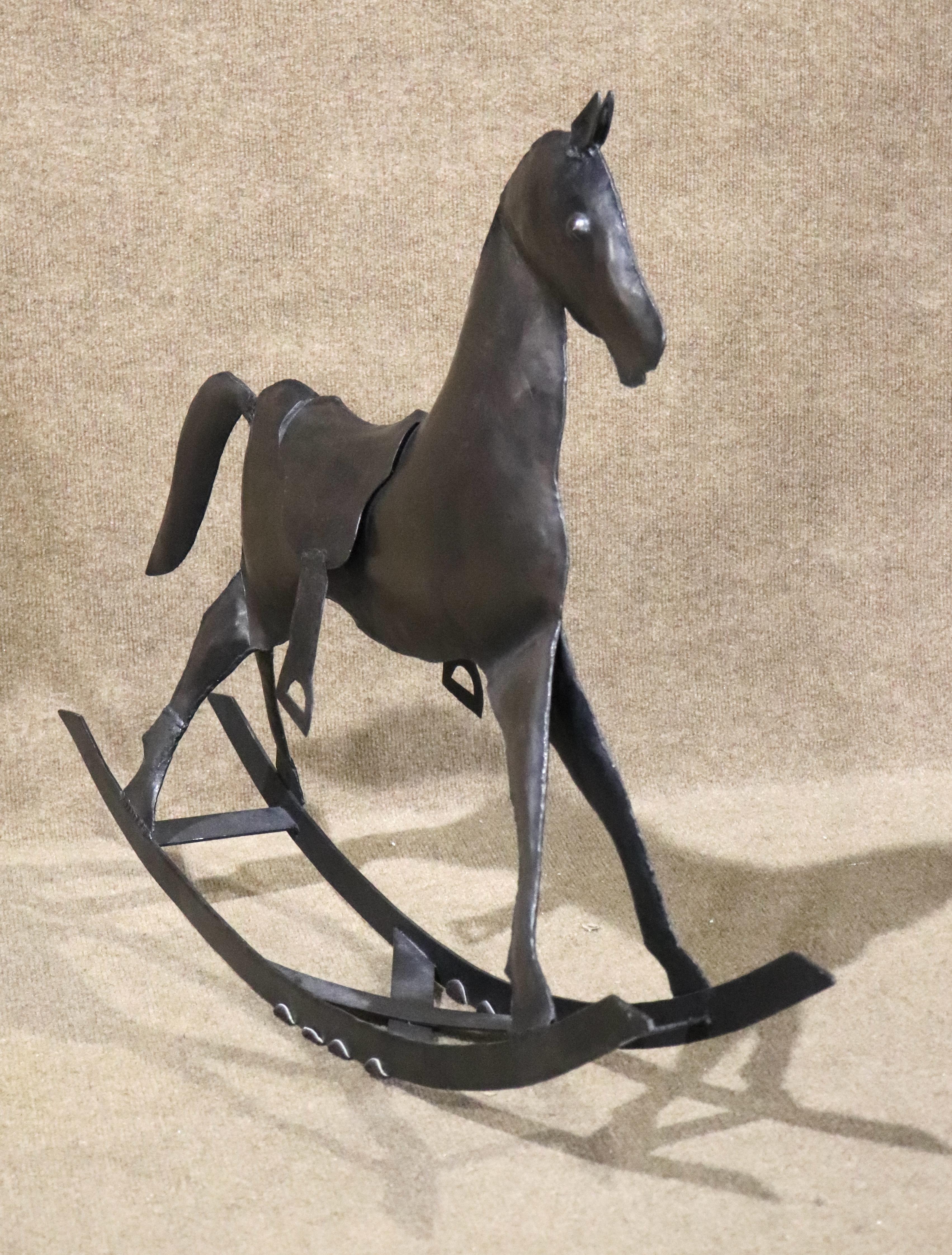 This fun handmade rocking horse is made fully of sheets of metal, welded to create a child's horse.
Please confirm location NY or NJ
