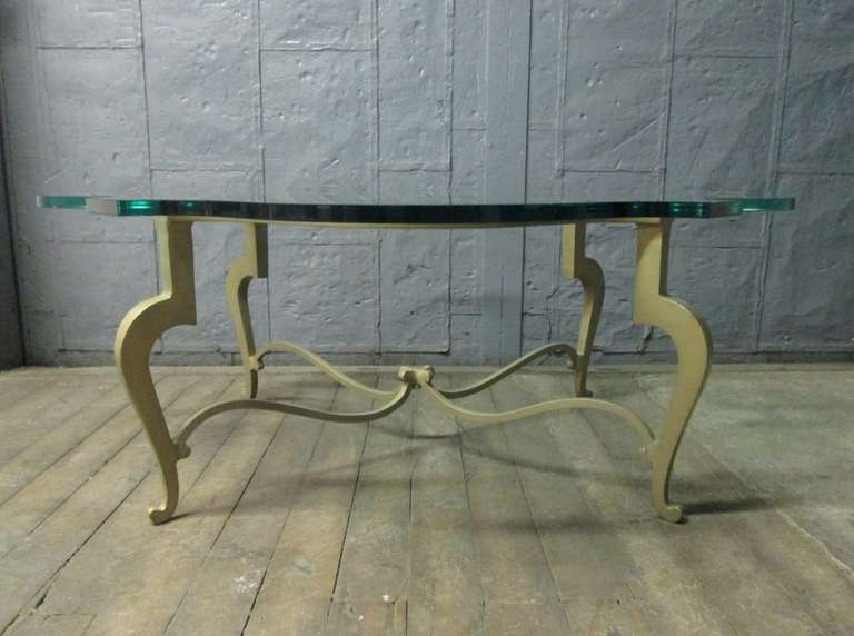 Iron scalloped edge and glass coffee table.