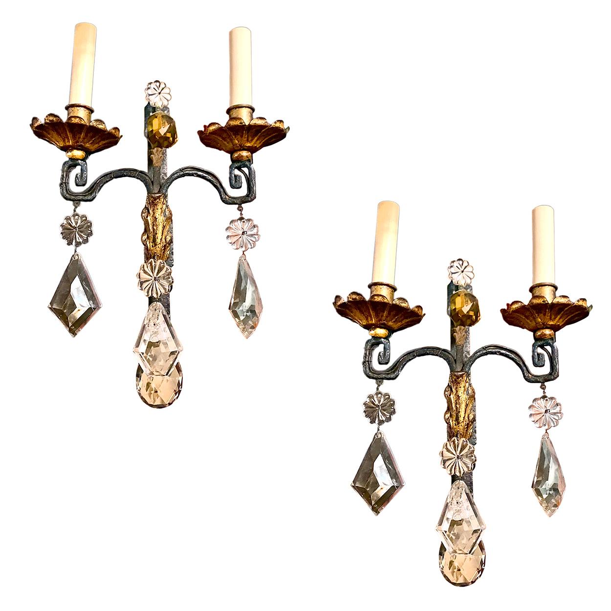 A pair of 1920s French painted and gilt wrought iron sconces with hanging crystal. 
 Measurements:
Height: 15