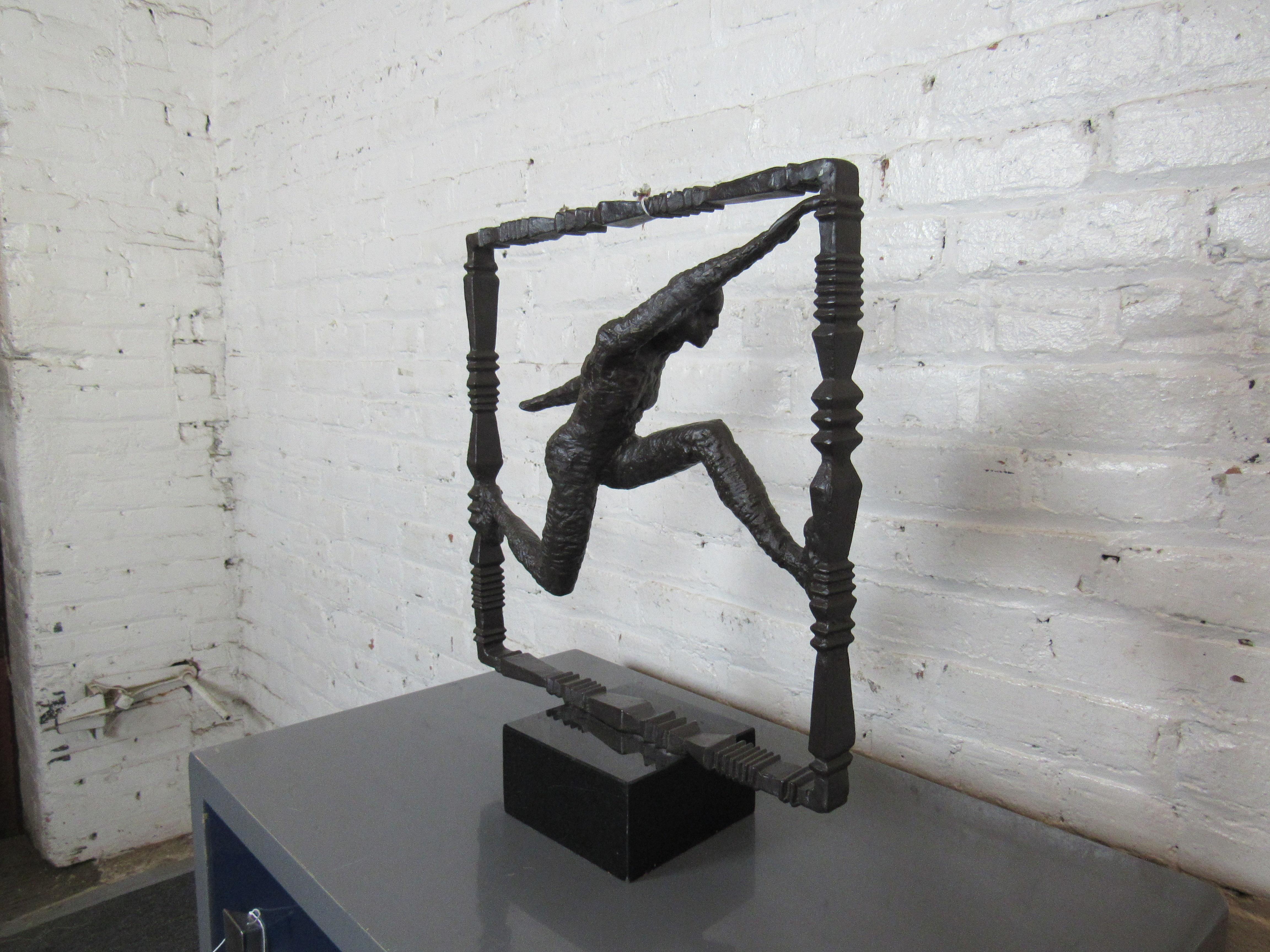 This interesting table sculpture features a running athletic figure welded from iron. Please confirm item location with seller (NY/NJ).