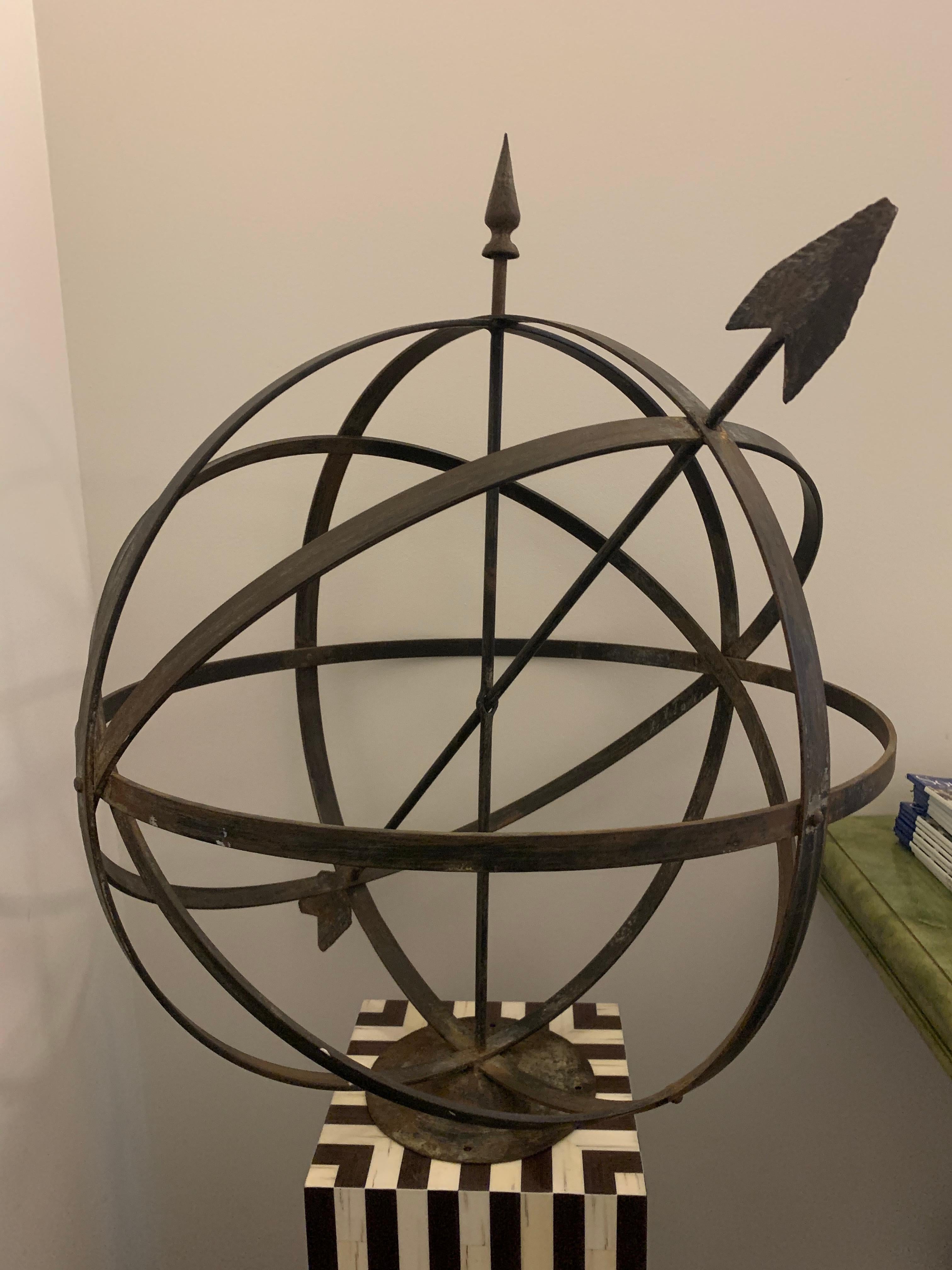 Iron sphere garden ornament. 

Property from esteemed interior designer Juan Montoya. Juan Montoya is one of the most acclaimed and prolific interior designers in the world today. Juan Montoya was born and spent his early years in Colombia. After