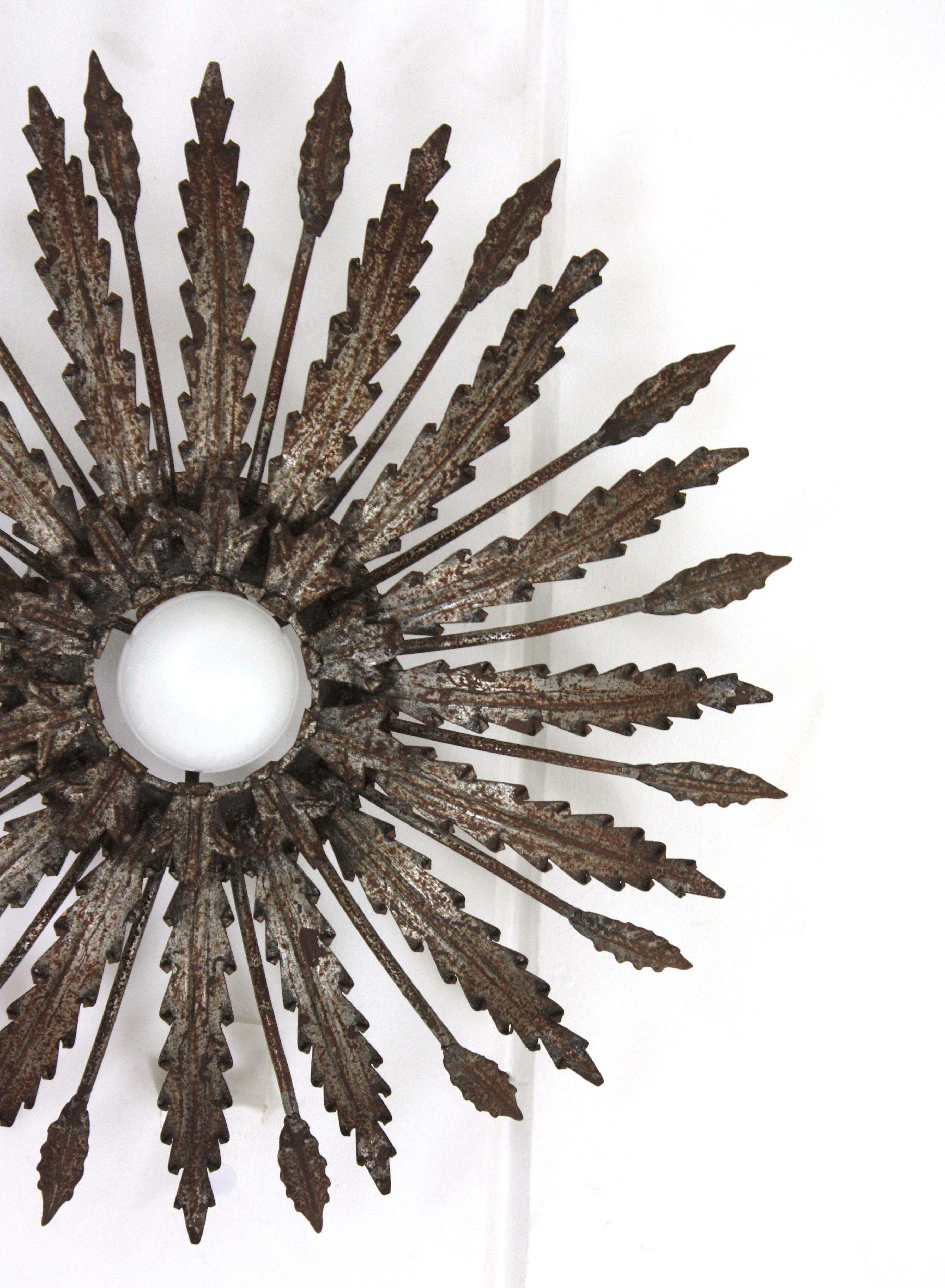 Iron Sunburst Ceiling Light Fixture with Leaves Design and Rusty Patina For Sale 3