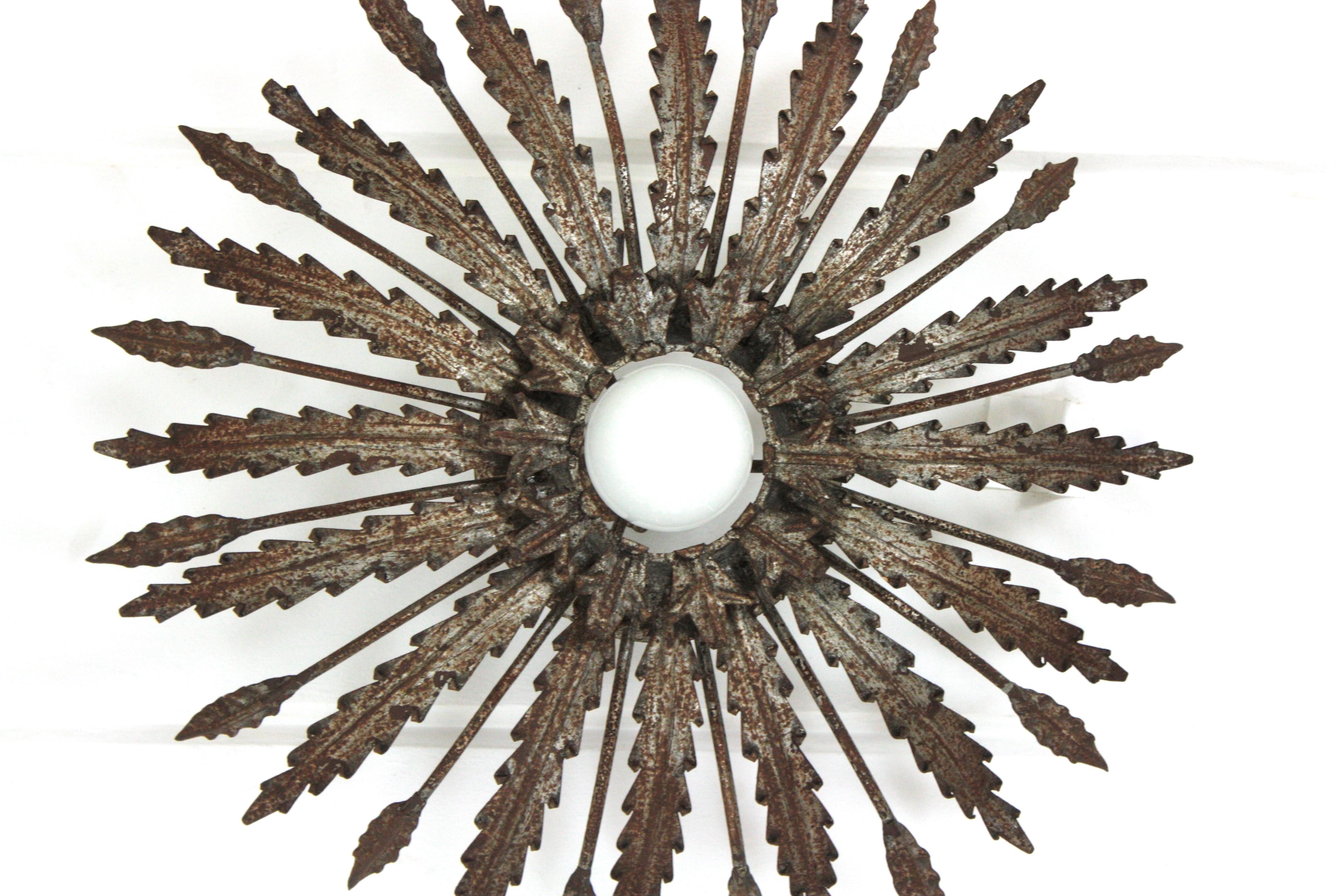Iron Sunburst Ceiling Light Fixture with Leaves Design and Rusty Patina For Sale 5