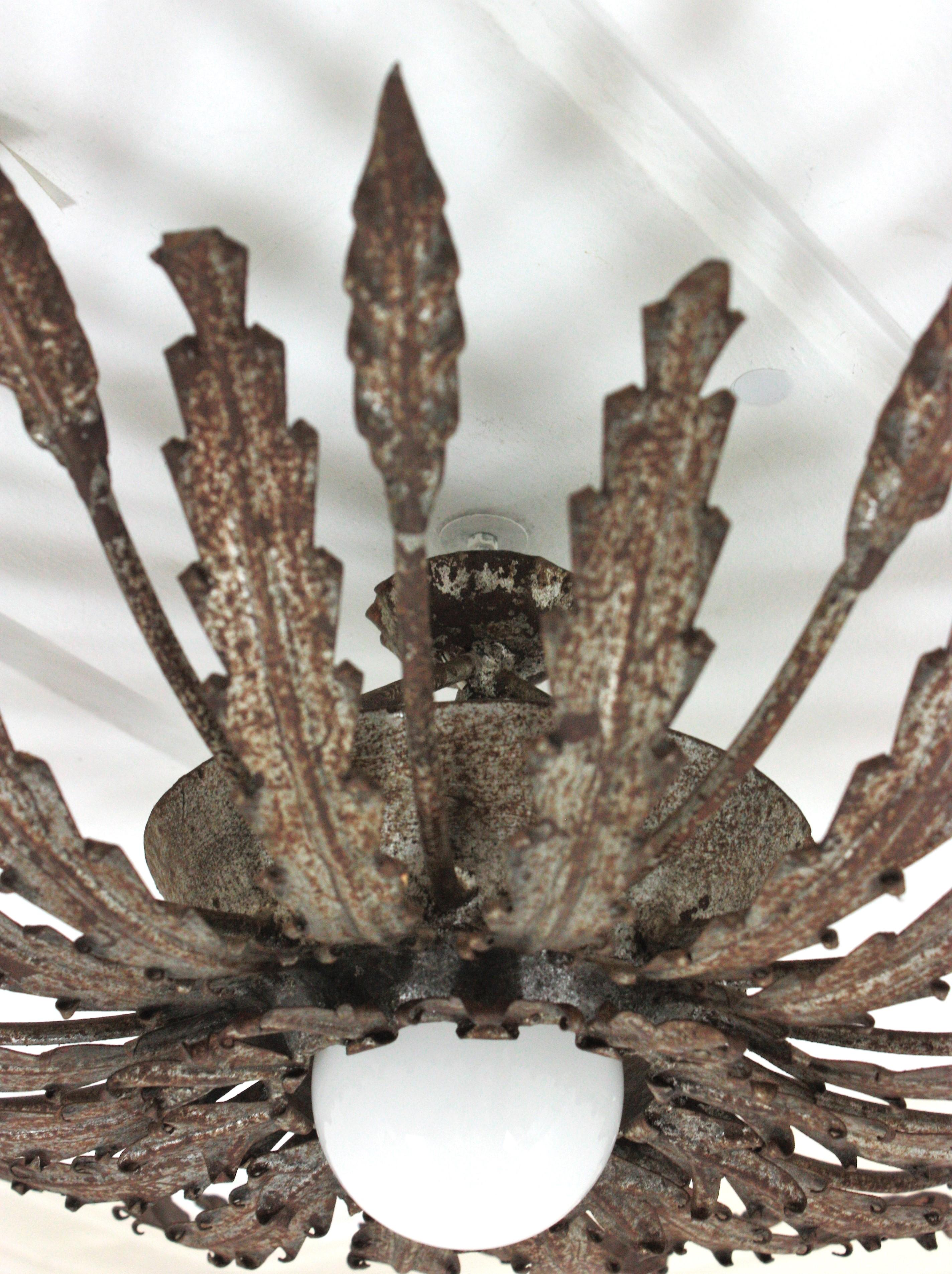 Iron Sunburst Ceiling Light Fixture with Leaves Design and Rusty Patina For Sale 8