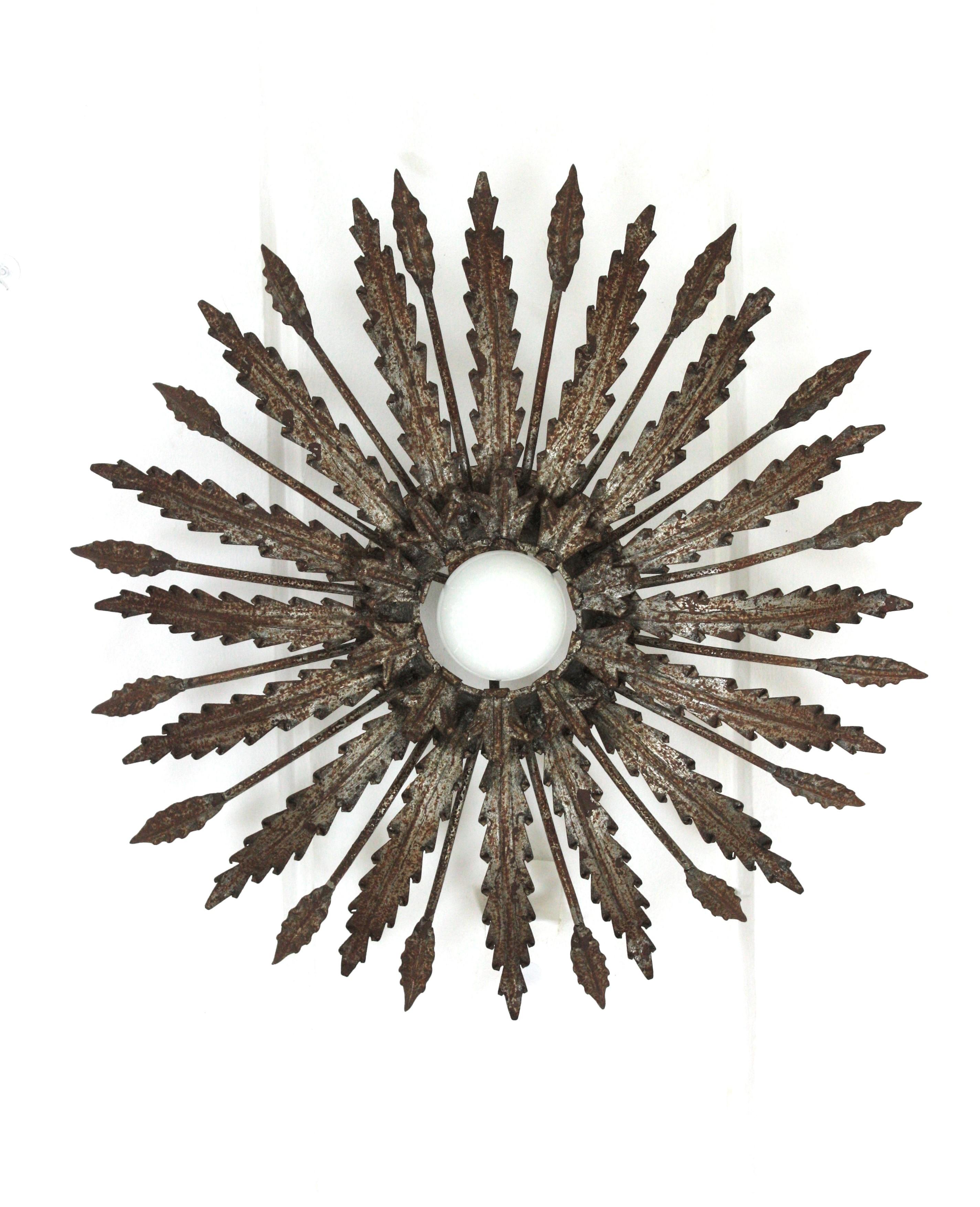 Iron Sunburst Ceiling Light Fixture with Leaves Design and Rusty Patina For Sale 1