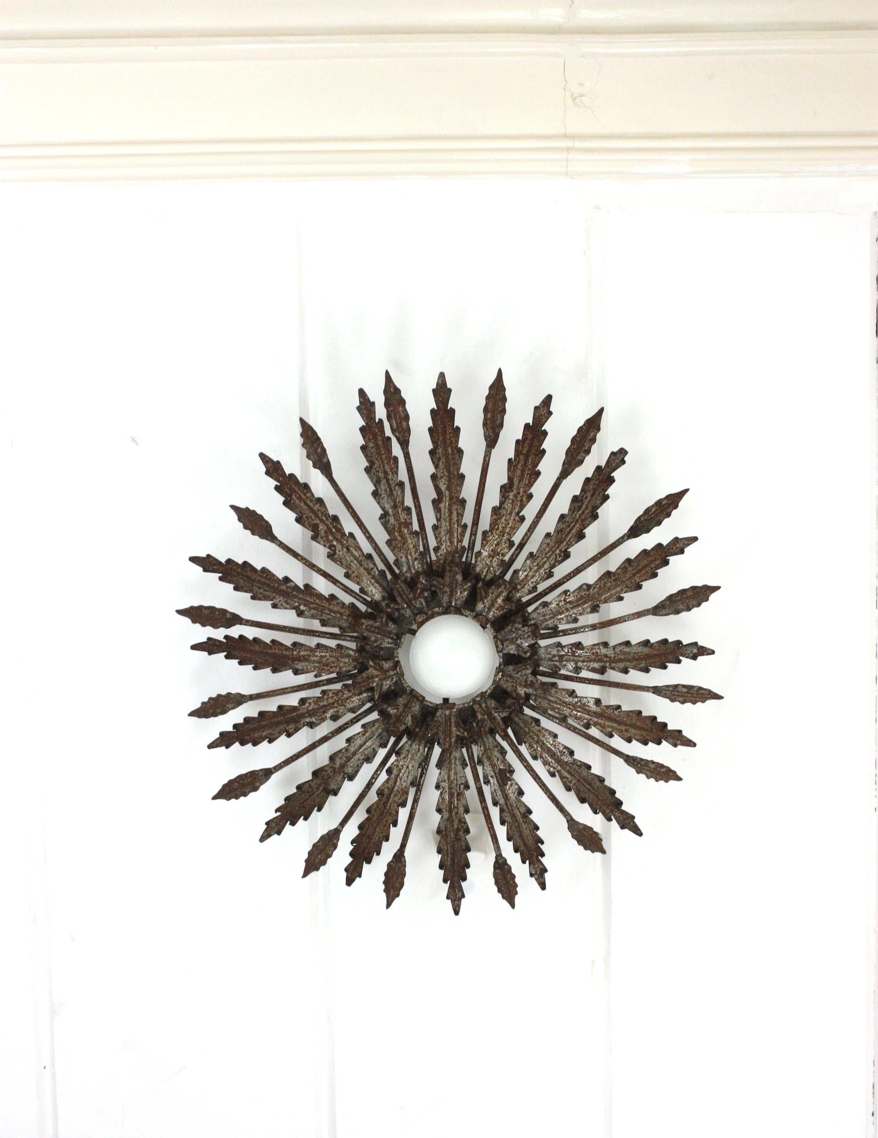 Iron Sunburst Ceiling Light Fixture with Leaves Design and Rusty Patina For Sale 2