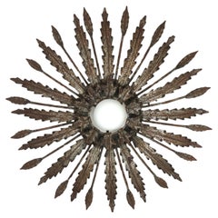 Sonnenschliff-Deckenleuchte aus Eisen mit Blättern-Design und rostfarbener Patina