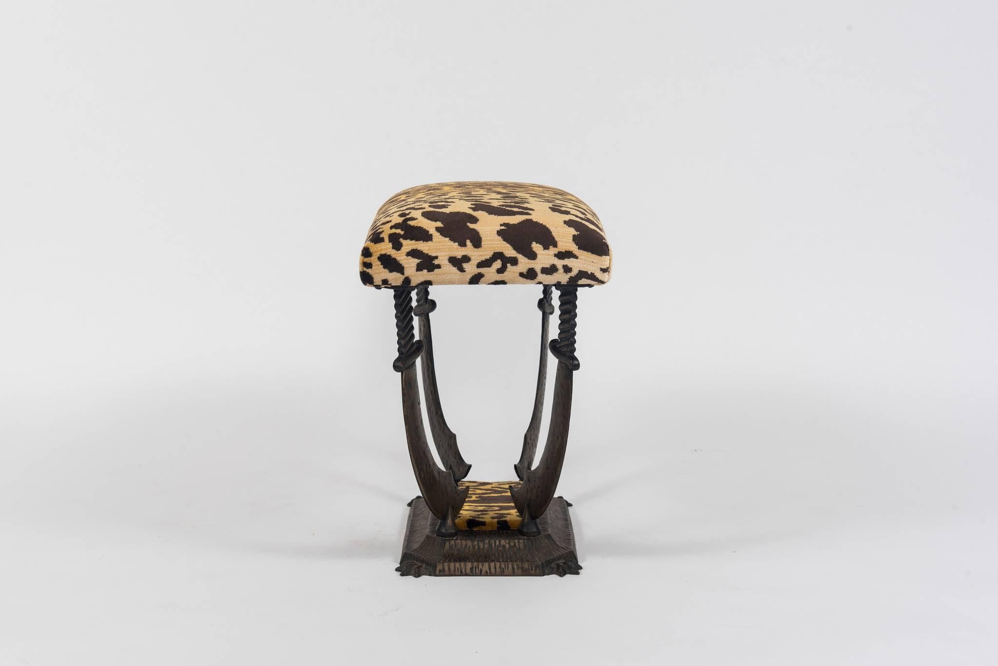 A vintage Flemish iron sword bench newly upholstered in a leopard silk velvet.