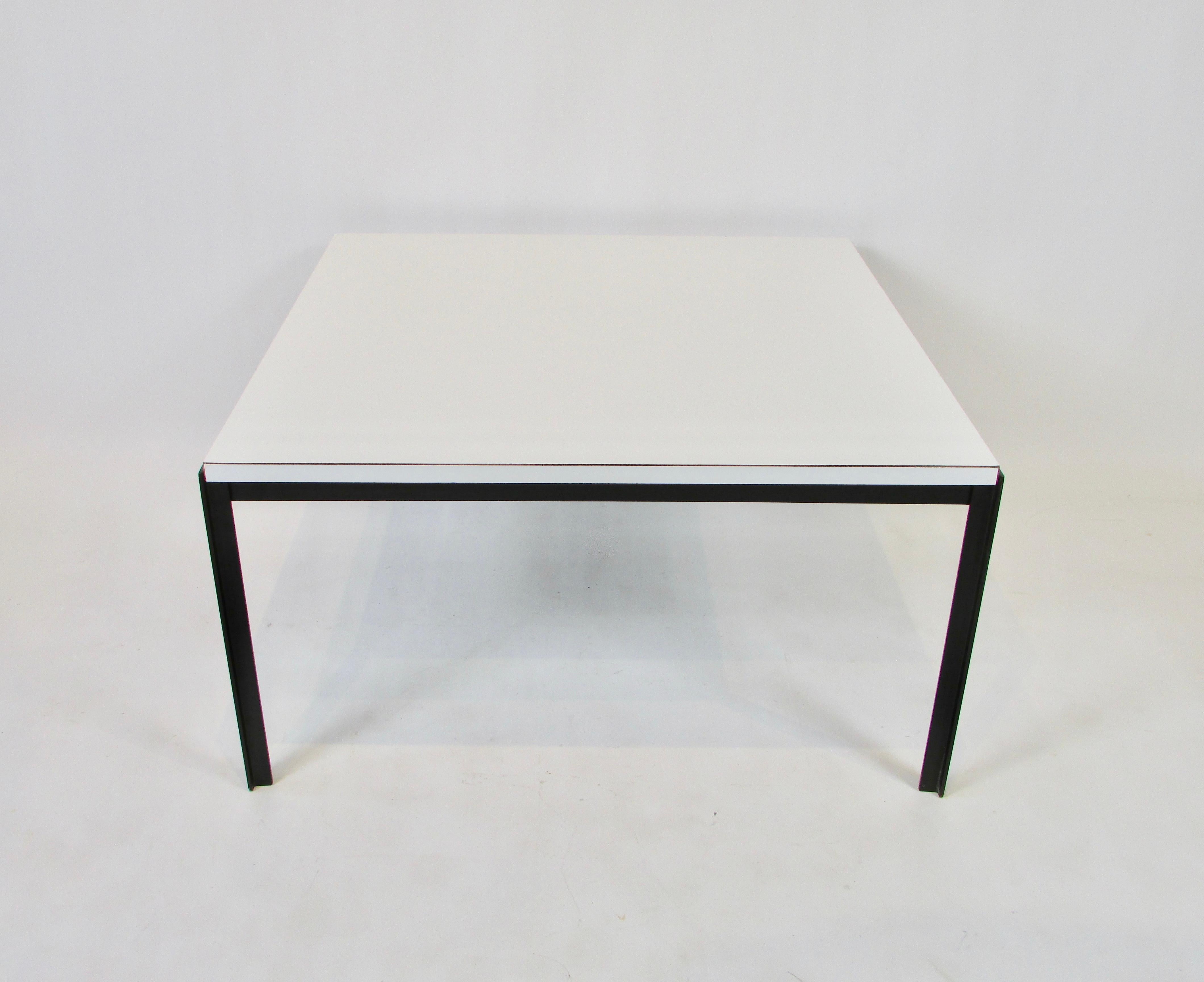 An iron based coffee or side table with a white laminate top by Florence Knoll, 1960s. Good original condition. Original label on underside.