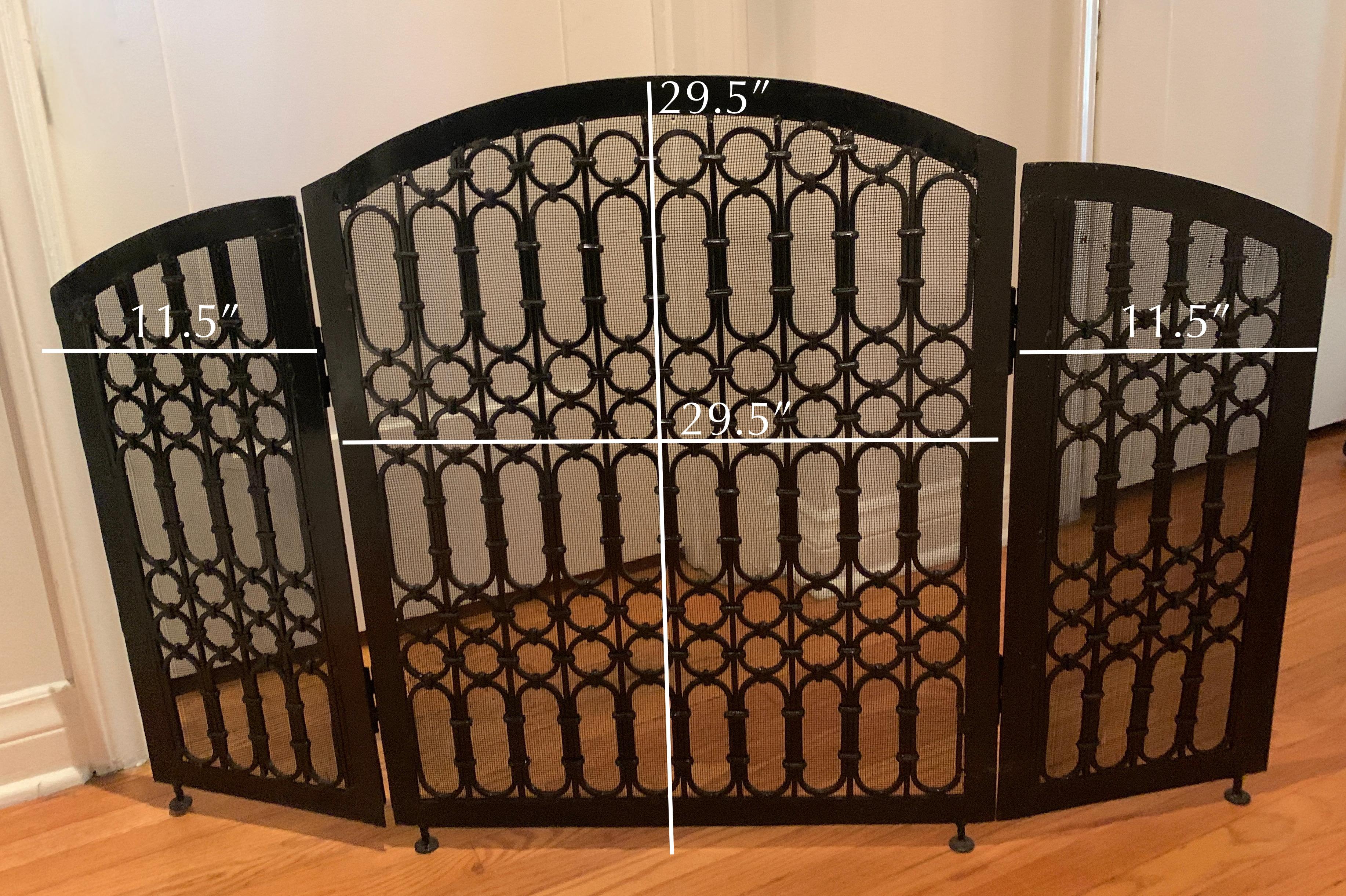 Very heavy and beautifully fabricated three panel fireplace screen - A thoughtful design that is a well made free standing wrought iron screen, very intricate linked round and oblong loops make up the three panels.. Most definitely compliments any