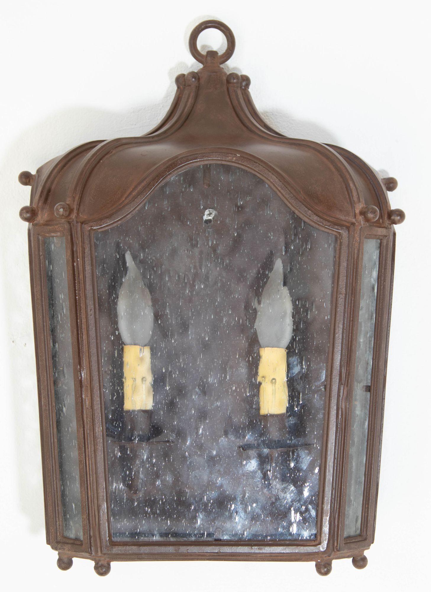 Outdoor hand-forged iron light fixtures by Dana Creath Designs.
Iron Wall Lantern With Antique Rust Finish Glass Enclosed 2-Arm Sconce 1 of 6 for Outdoors.
This Antique European look half wall iron lantern will bring a classic look to your favorite