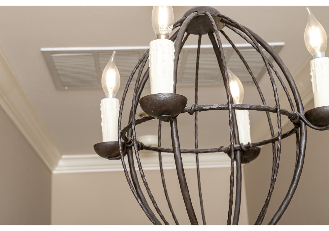 Industrial Iron Ware International Elongated Spherical Pendant With Four Lights For Sale