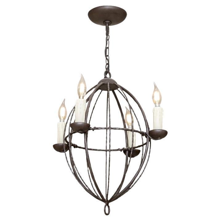 Iron Ware International Elongated Spherical Pendant With Four Lights For Sale