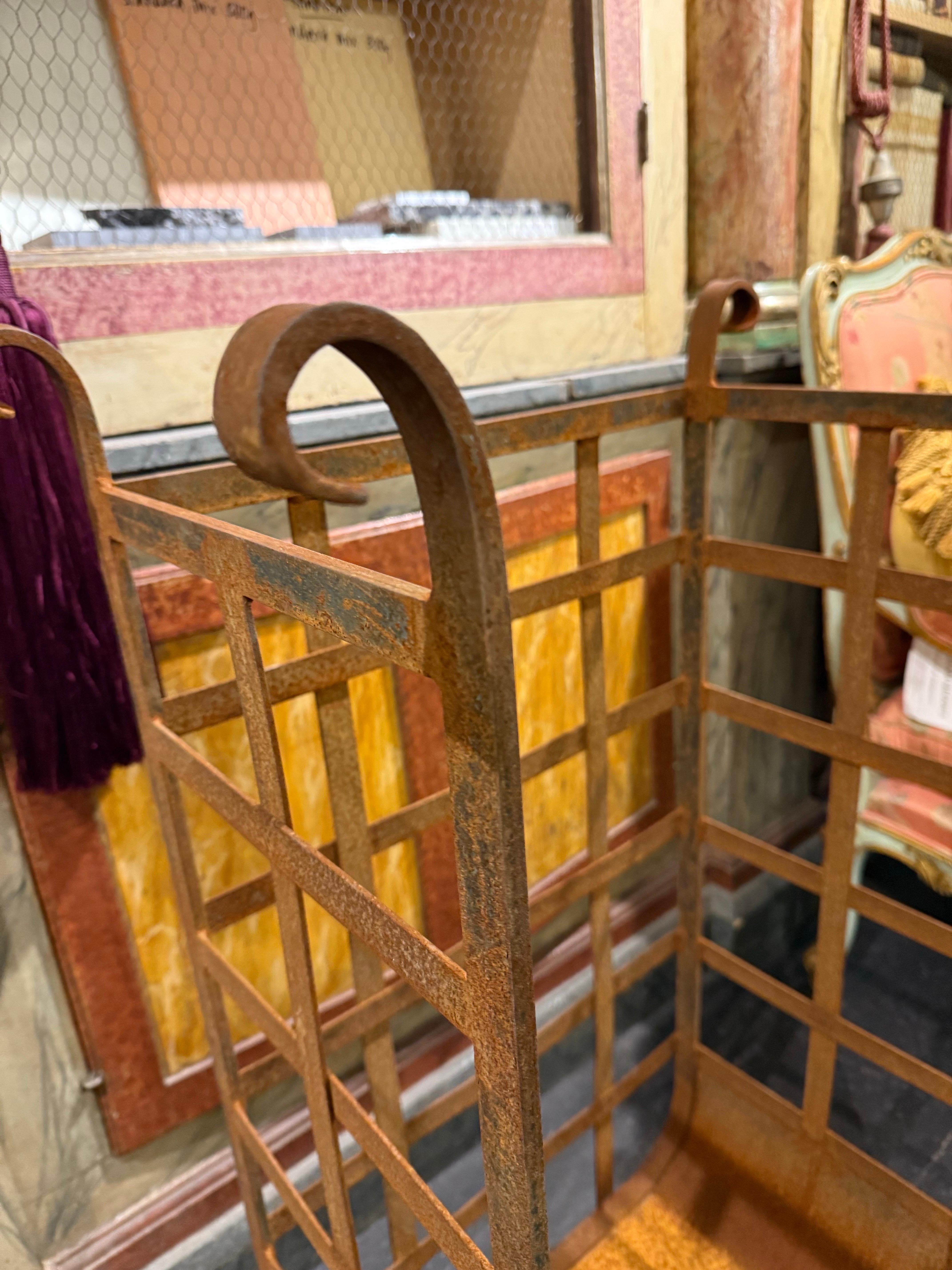 An Iron Wood Cradles
Hand forged.

Provenance: Private Australian Collection.

Dimensions:
Height: 101cm.
Width: 61cm.
Depth: 34cm.