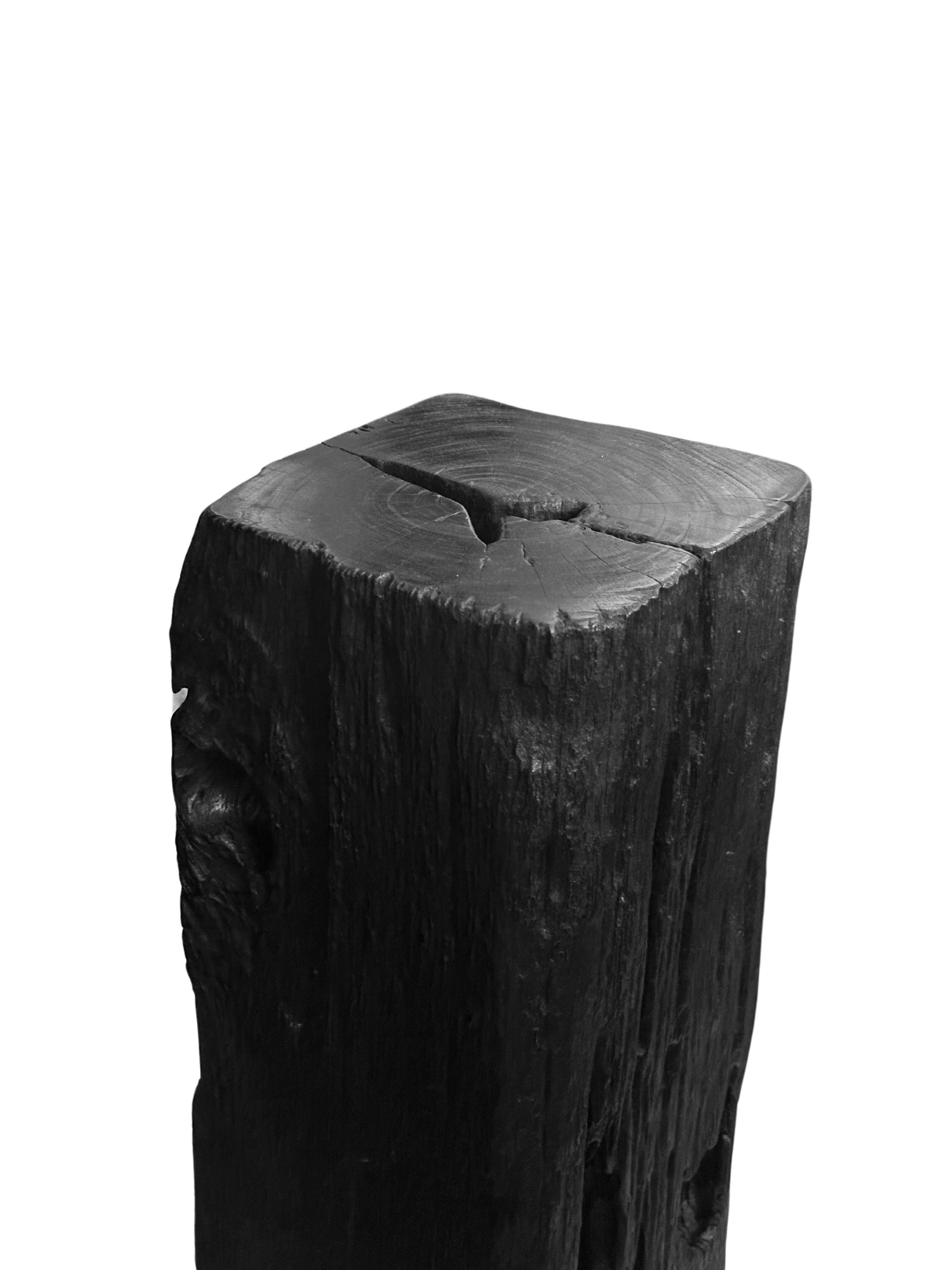 This exquisite iron wood pedestal showcases the natural beauty of the wood, featuring stunning, intricate textures that highlight its rich grain. The dark burnt finish adds a dramatic touch, enhancing the pedestal's elegance while accentuating the