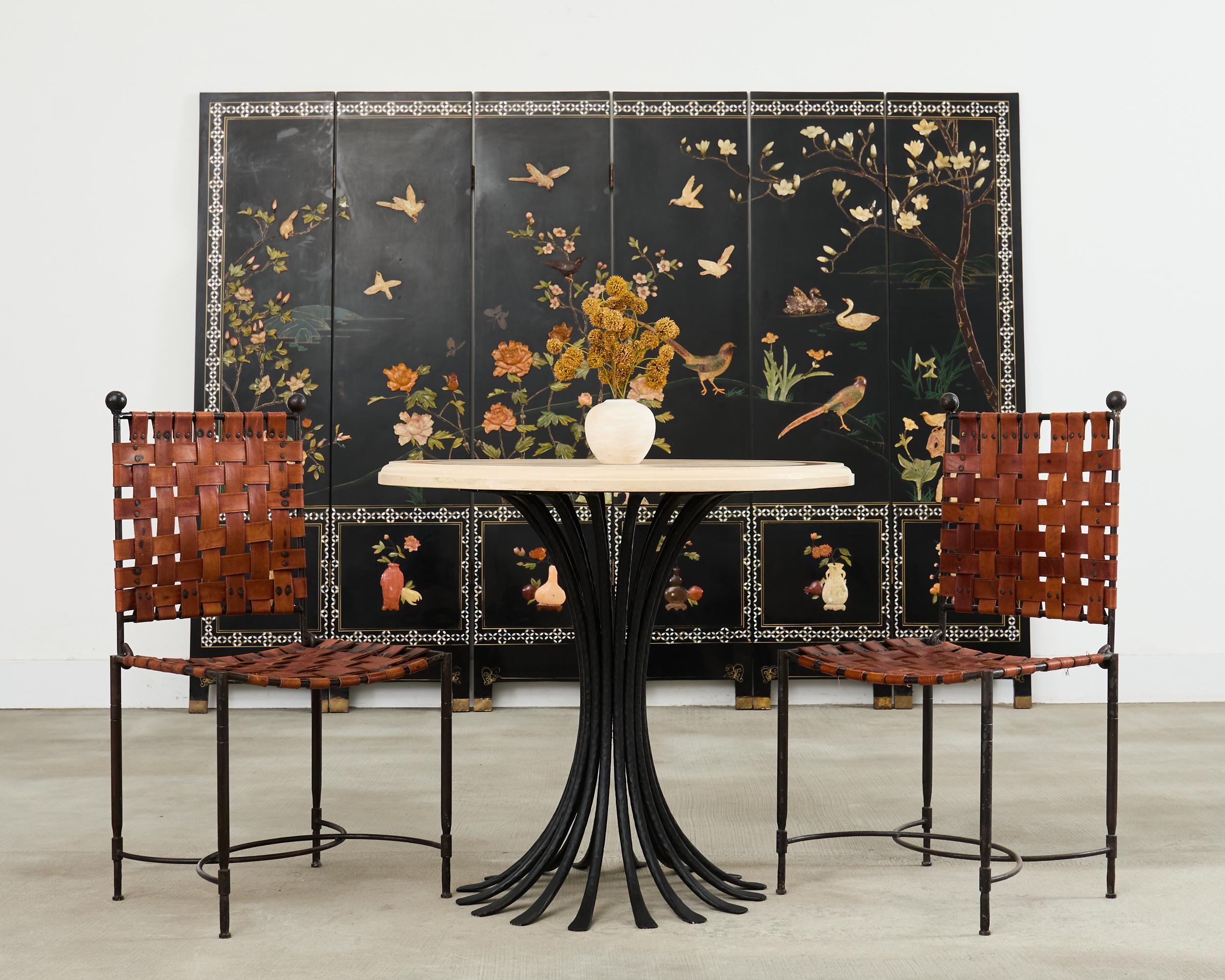 Dramatic molded stone top pedestal dining table or center table by Ironies Hollywood, California. The 