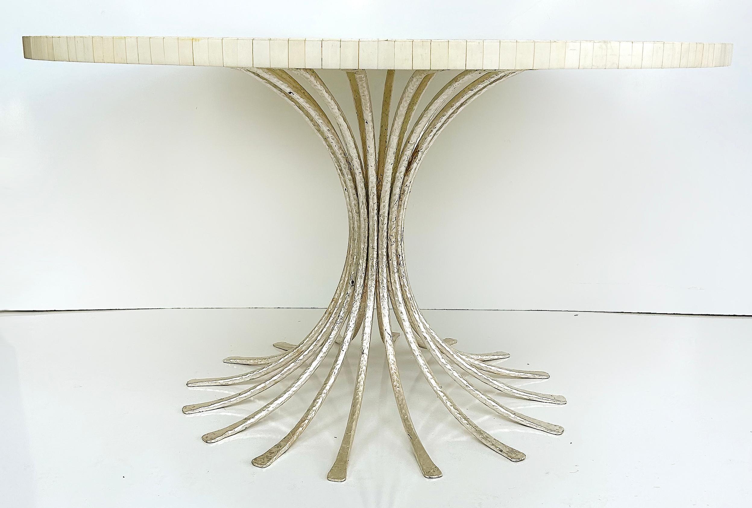 Ironies Tessellated Bone Sunburst Top Dining Table with Silver Gilt Metal Base

Offered for sale is an Ironies tessellated bone sunburst pattern dining room table top with a silver gilt metal base. The base is Ironies 