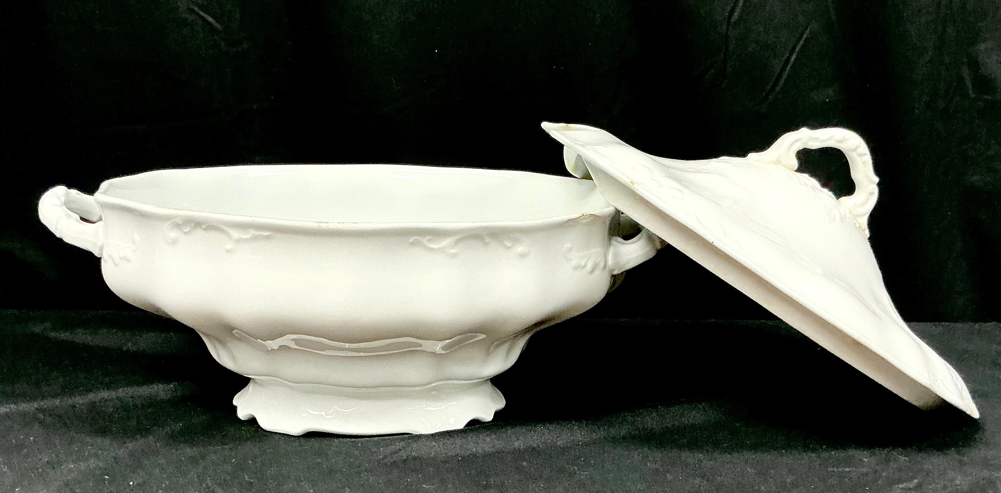 Early 20th Century Large White Ironstone Soup Tureen with Lid by Johnson Brothers in Staffordshire, England. Tureen is made from durable Royal Ironstone China and retains a bright, glossy finish. Piece features graceful curves, scalloped pedestal,
