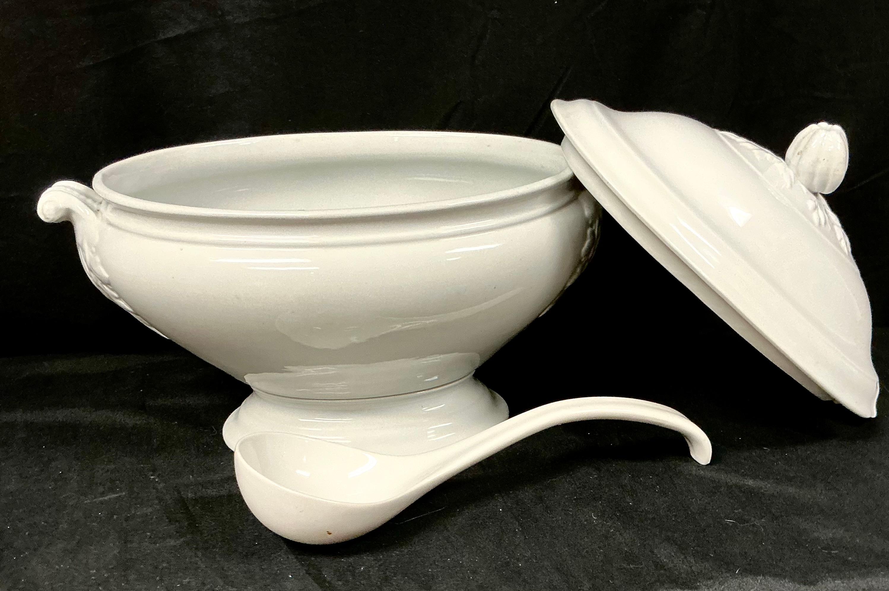 19th Century White Ironstone Soup Tureen with Lid is a lovely piece of Victorian-era English Pottery. This tureen was manufactured by the J.&G. Meakin company in Hanley, Staffordshire, England. The lid is domed with a fruit-shaped handle and has a a