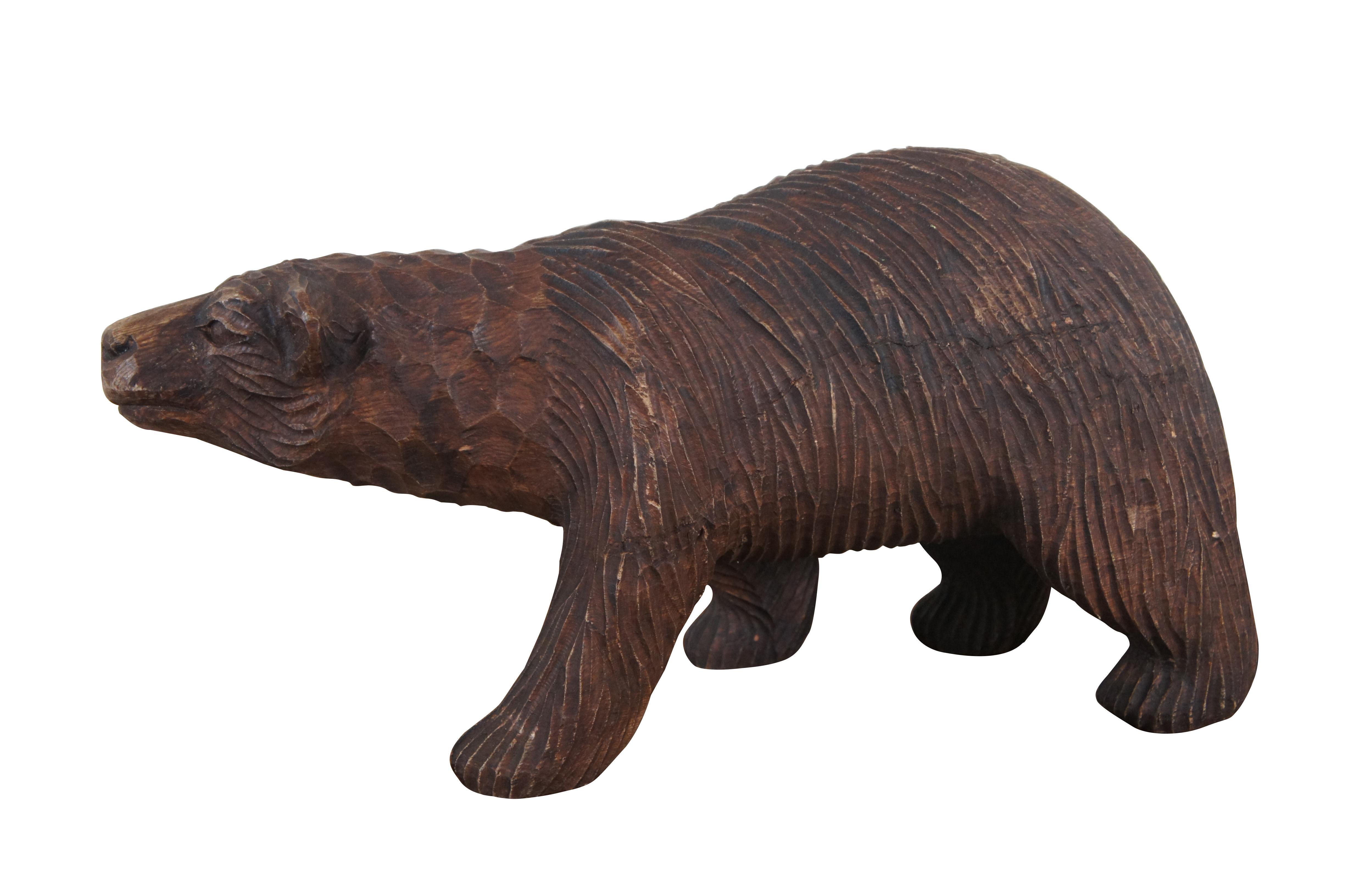 Vintage carved iron wood sculpture / figurine in the shape of a grizzly bear walking on all fours. Rustic hunting lodge decor.

Dimensions:
18