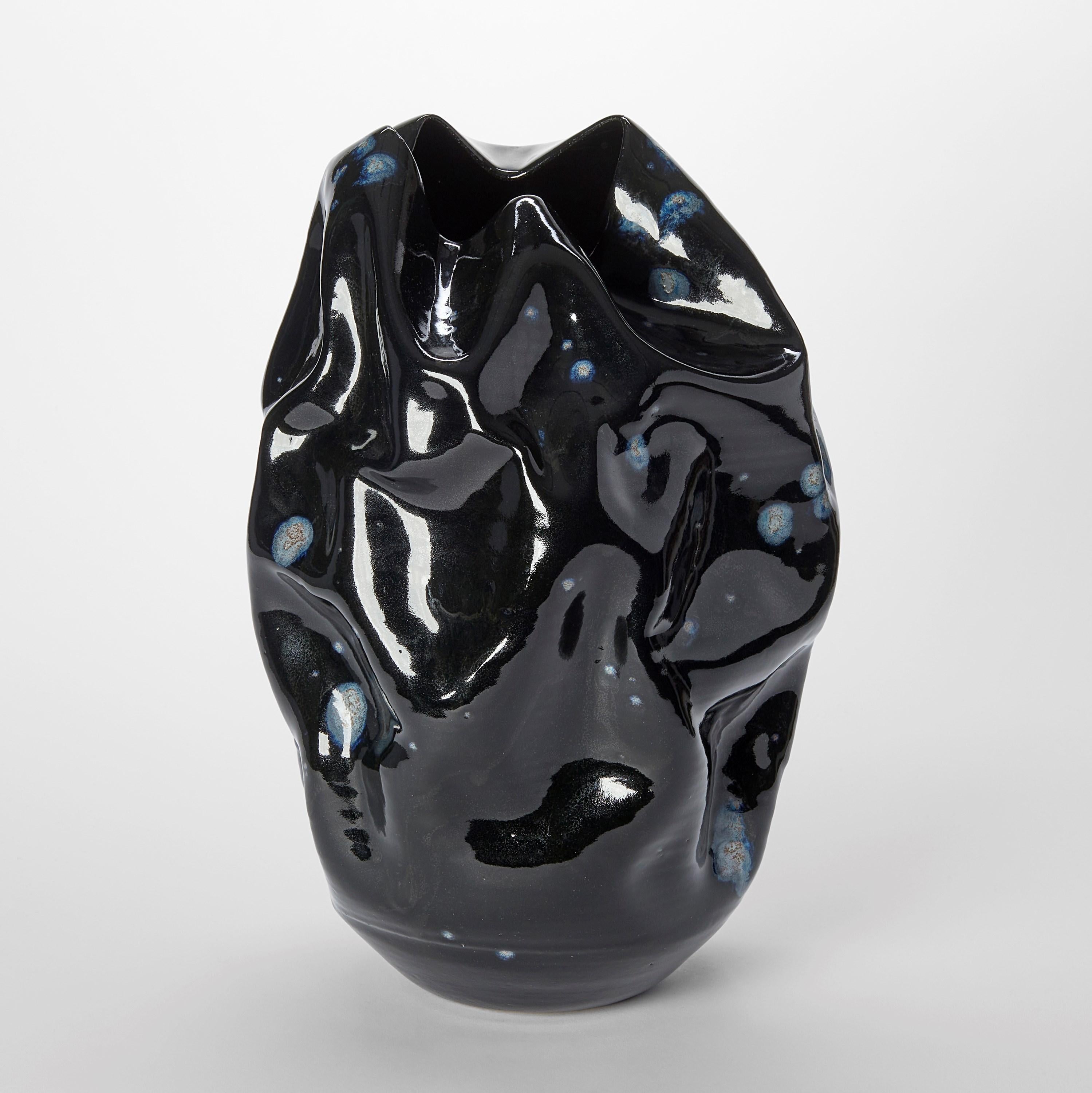 ‘Irregular Form with Cosmic Galactic Highlights No 121’ is a unique sculptural vessel by the British artist, Nicholas Arroyave-Portela.

Nicholas Arroyave-Portela’s professional ceramic practise began in 1994. After 20 years based in London, he