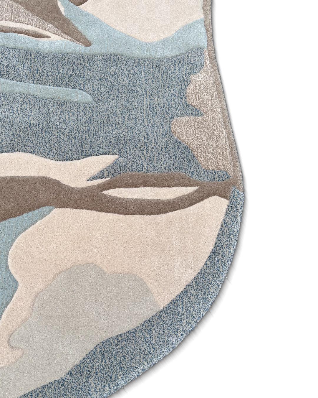 Just in: 'Frozen Lands,' a tufted rug that recalls memories of northeast Greenland beneath ironclad snow. Its colors: a muted blue borrowed from the gaping silence of frozen water, and subtle shards of brown—a testament to the persistent,