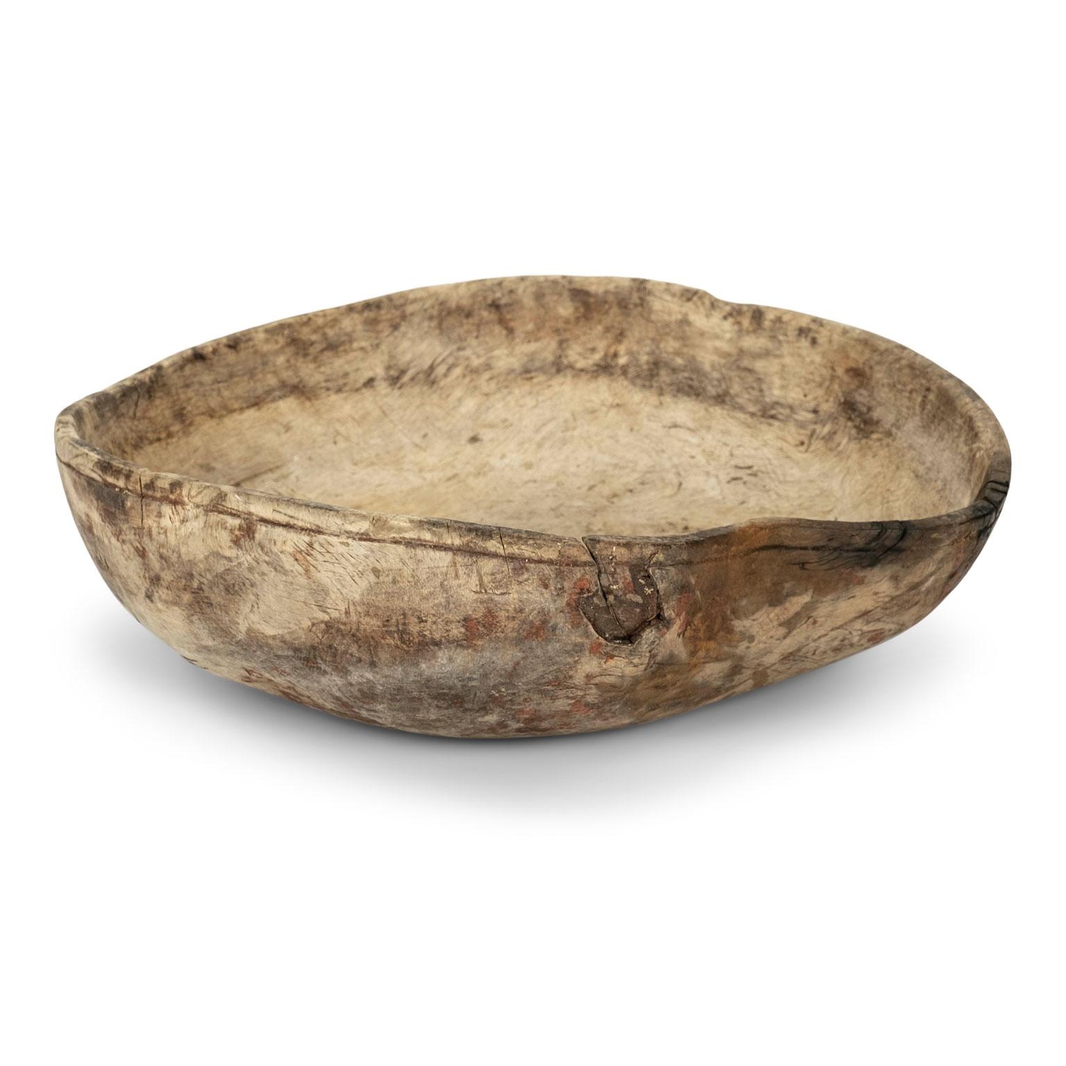 Irregular-shaped hand-carved Swedish root bowl dating to the 19th century.
