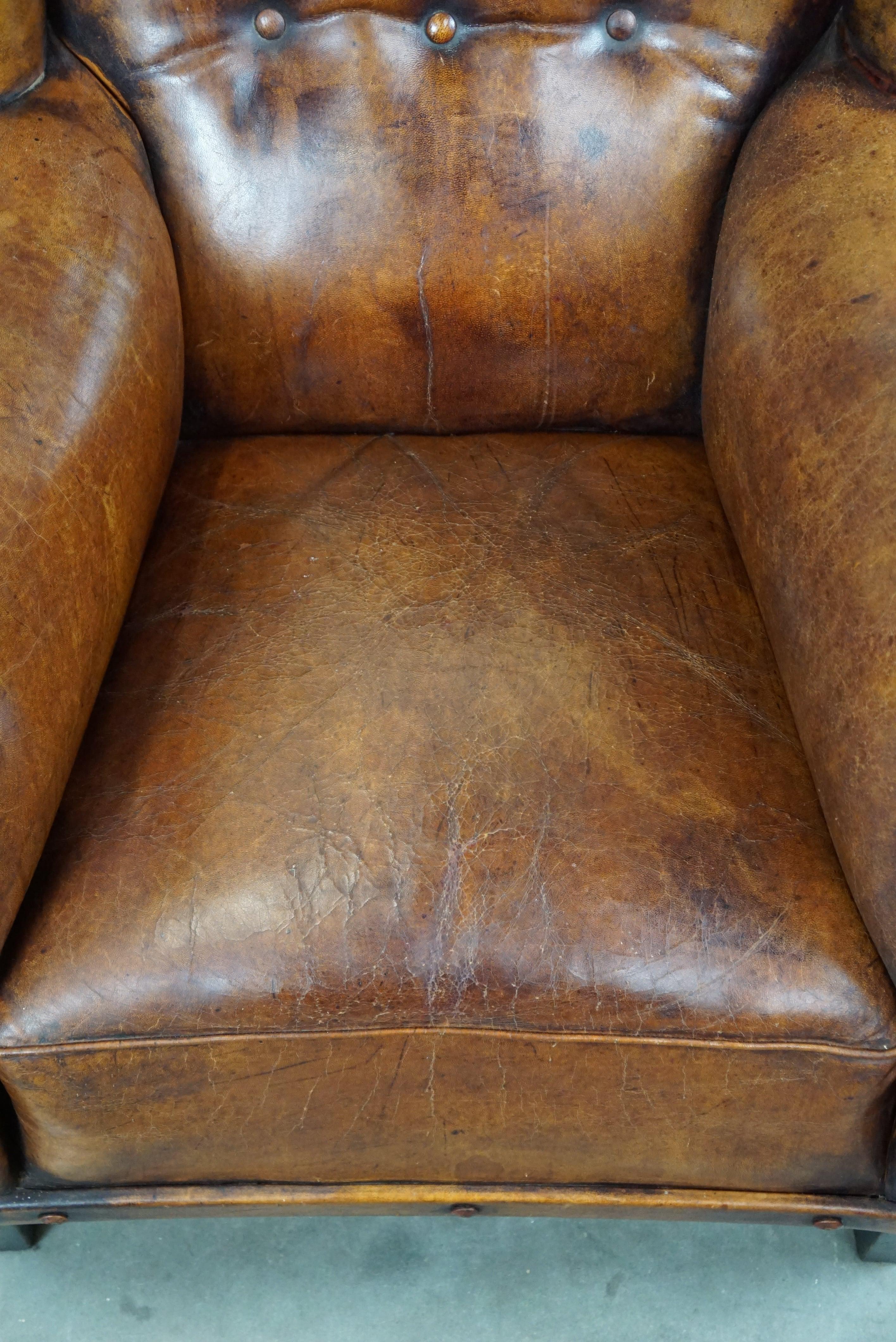 Leather Irresistible old sheep leather wingback armchair with the most beautiful colors For Sale