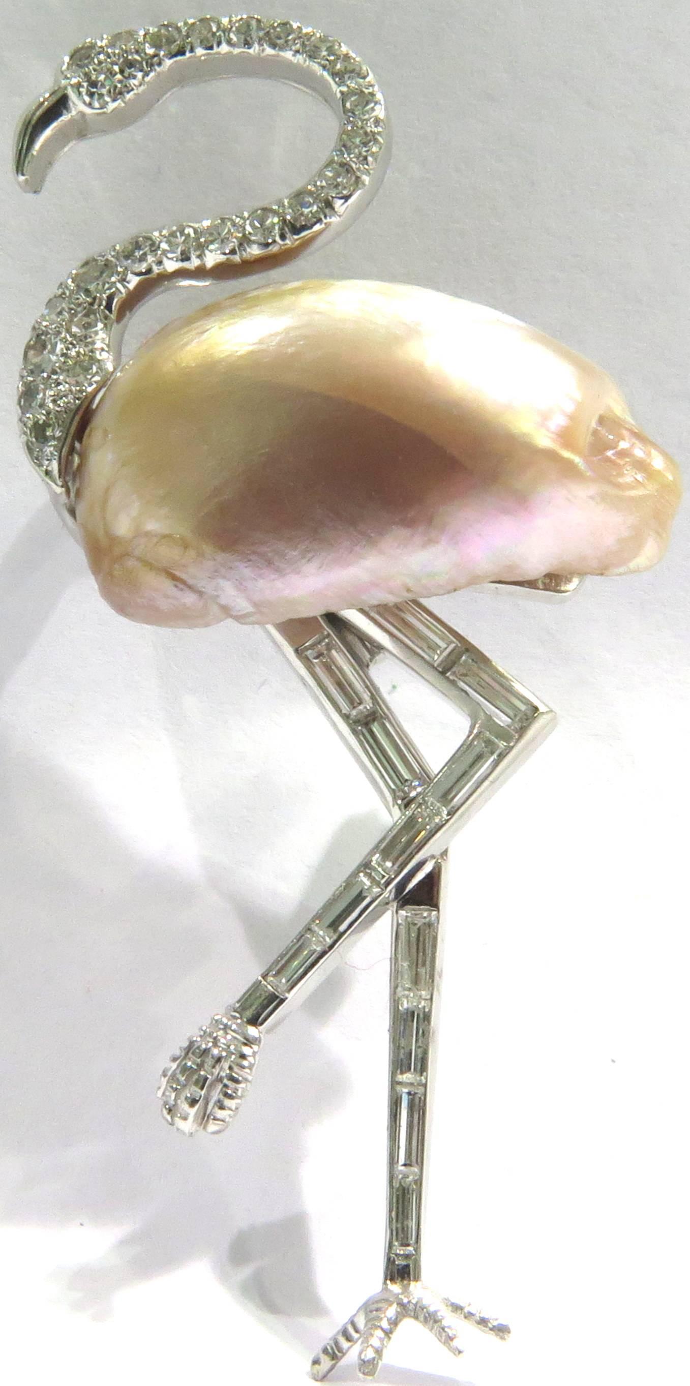 This exceptional little character is sure to always be a hit. With his long lean baguette diamond legs to his baroque pearl body, He will always be a star in your wardrobe. 
This pin measures 2 1/2 inches high by 1 1/8 inch across
This pin weighs