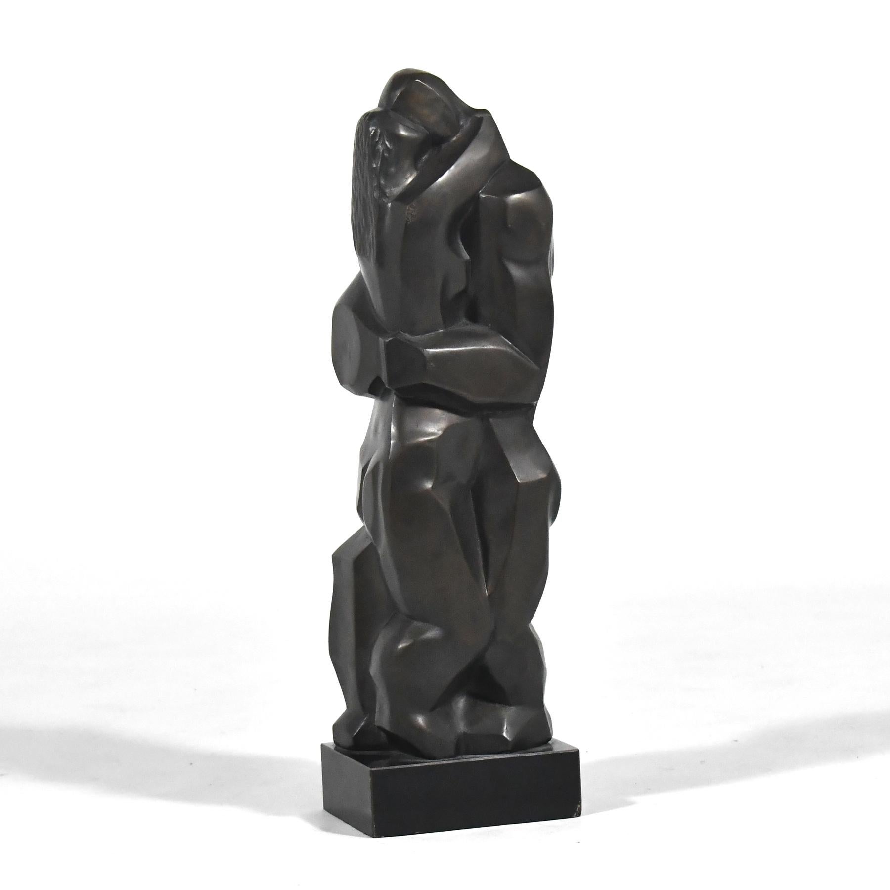 This wonderful bronze sculpture by Irving Amen (1918-2011) features a couple wrapped in an embrace in an abstract, almost cubist manner. The work is compelling from every angle and is mounted on a black stone base.

Amen was born in New York city,
