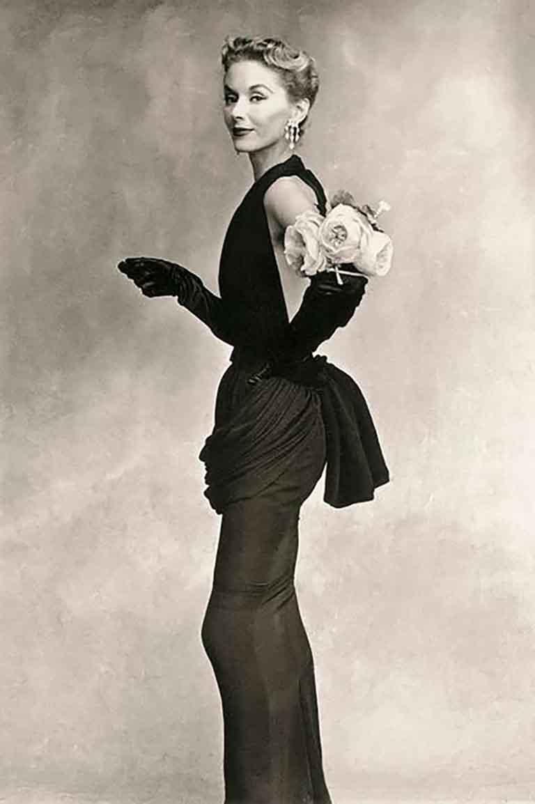 Irving Penn Color Photograph - Woman with Roses on her Arm (Lisa Fonssagrives-Penn in a Lafaurie Dress) 