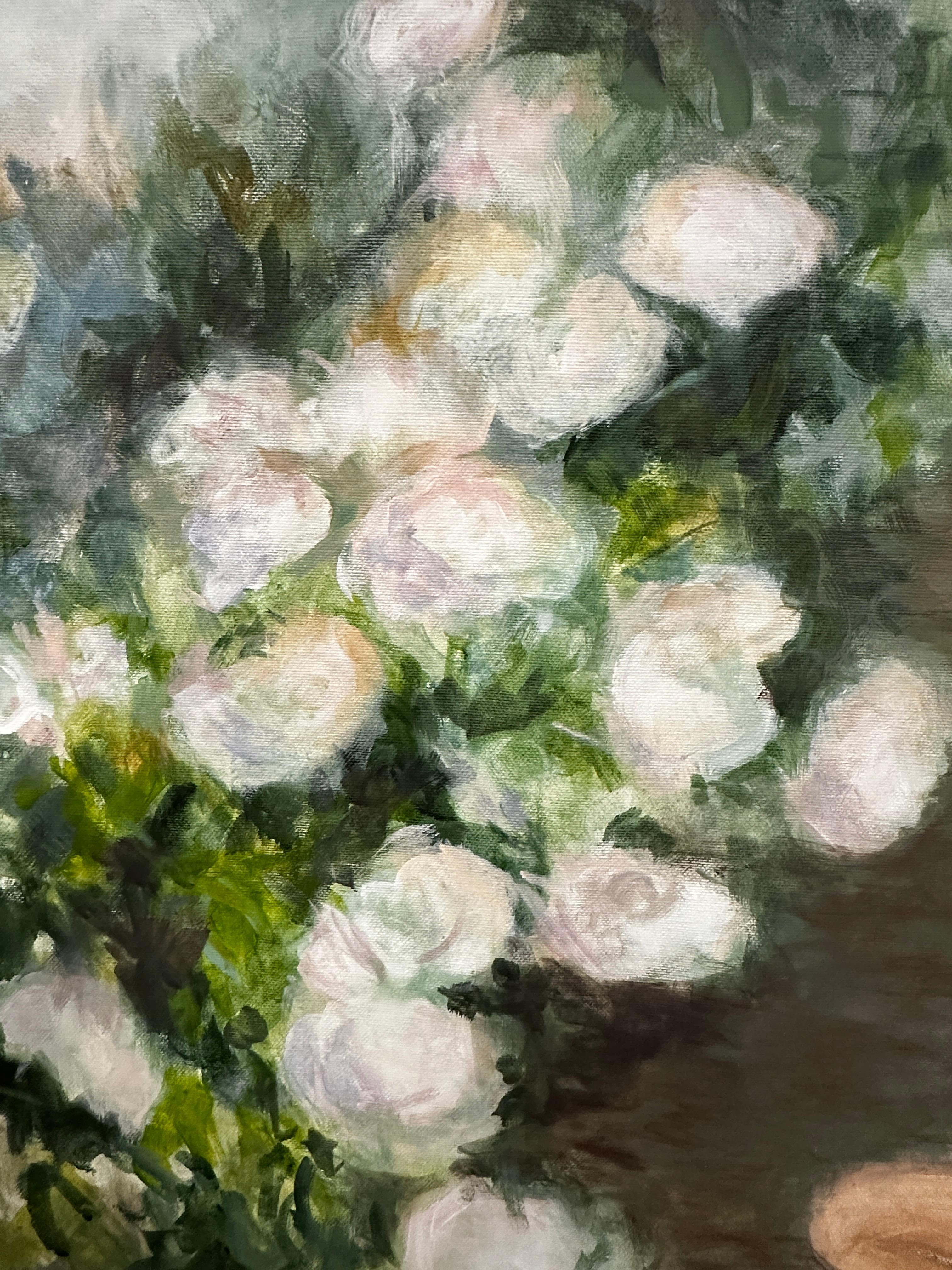 The space of Formula of Tenderness breathes with light. The hydrangeas along the path recall an endless sequence — like an equation composed of tenderness and light. On the ground, within this floral corridor, sits a girl, both focused and open to