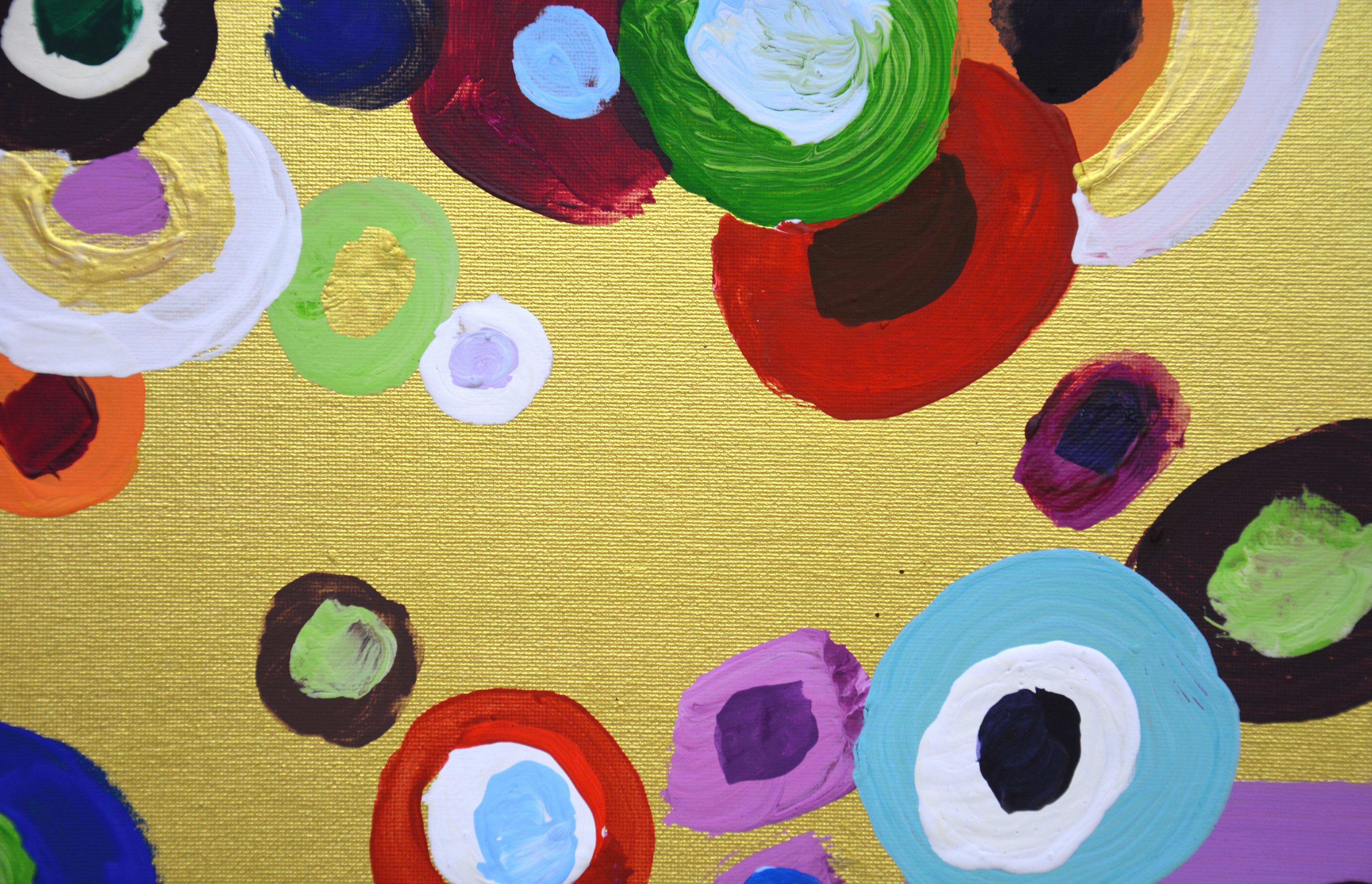 
Circles on gold 2. Energetic abstract painting with acrylics on canvas. Canvas on cardboard. The product has a modern aesthetic design. The work is filled with energy, the movement of round shapes, bright colors on a golden background. Painting is