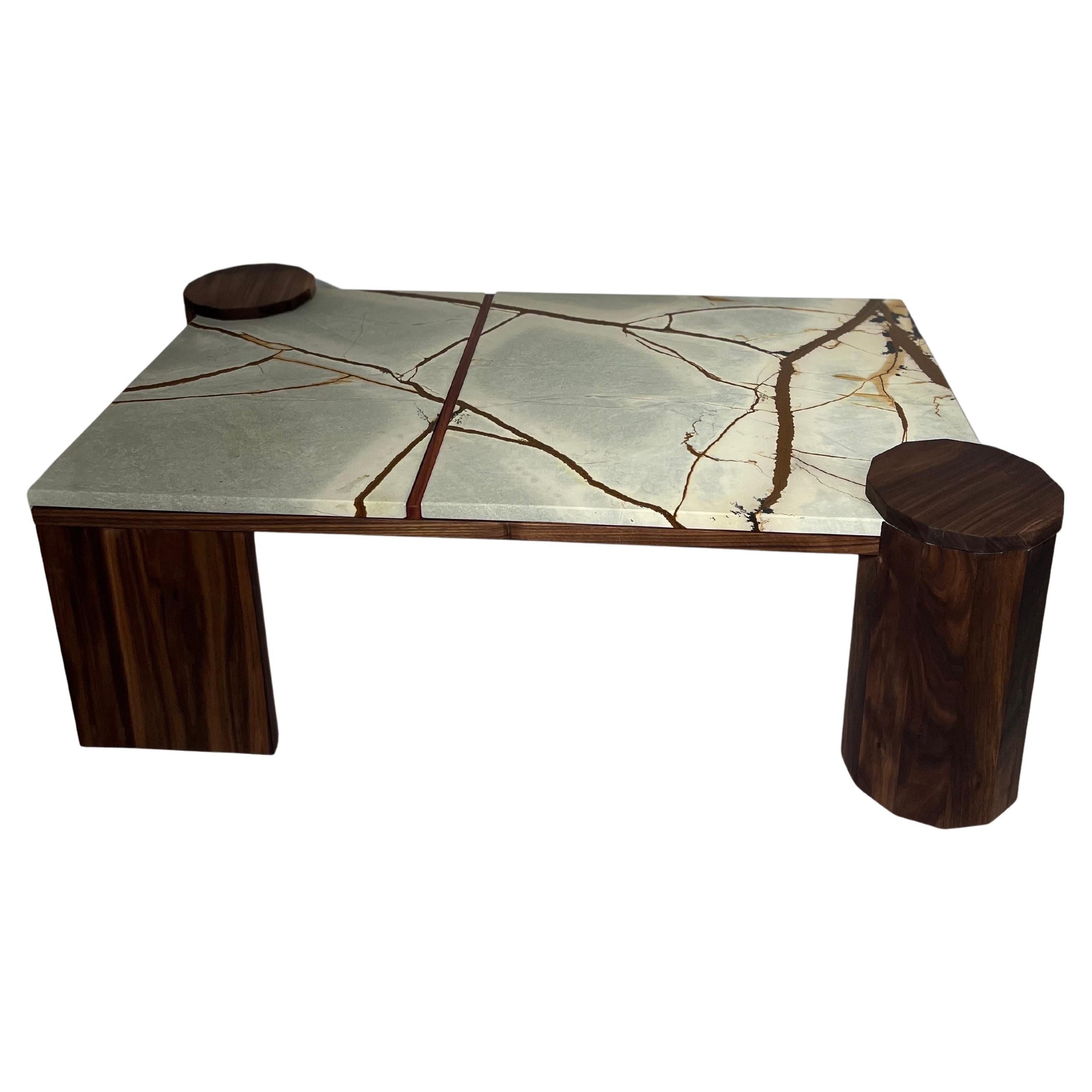This handcrafted table is a celebration of nature's artistry, designed to seamlessly blend into your living space while making a bold statement. The centerpiece of this creation is a meticulously chosen stone slab, its natural veining echoing the