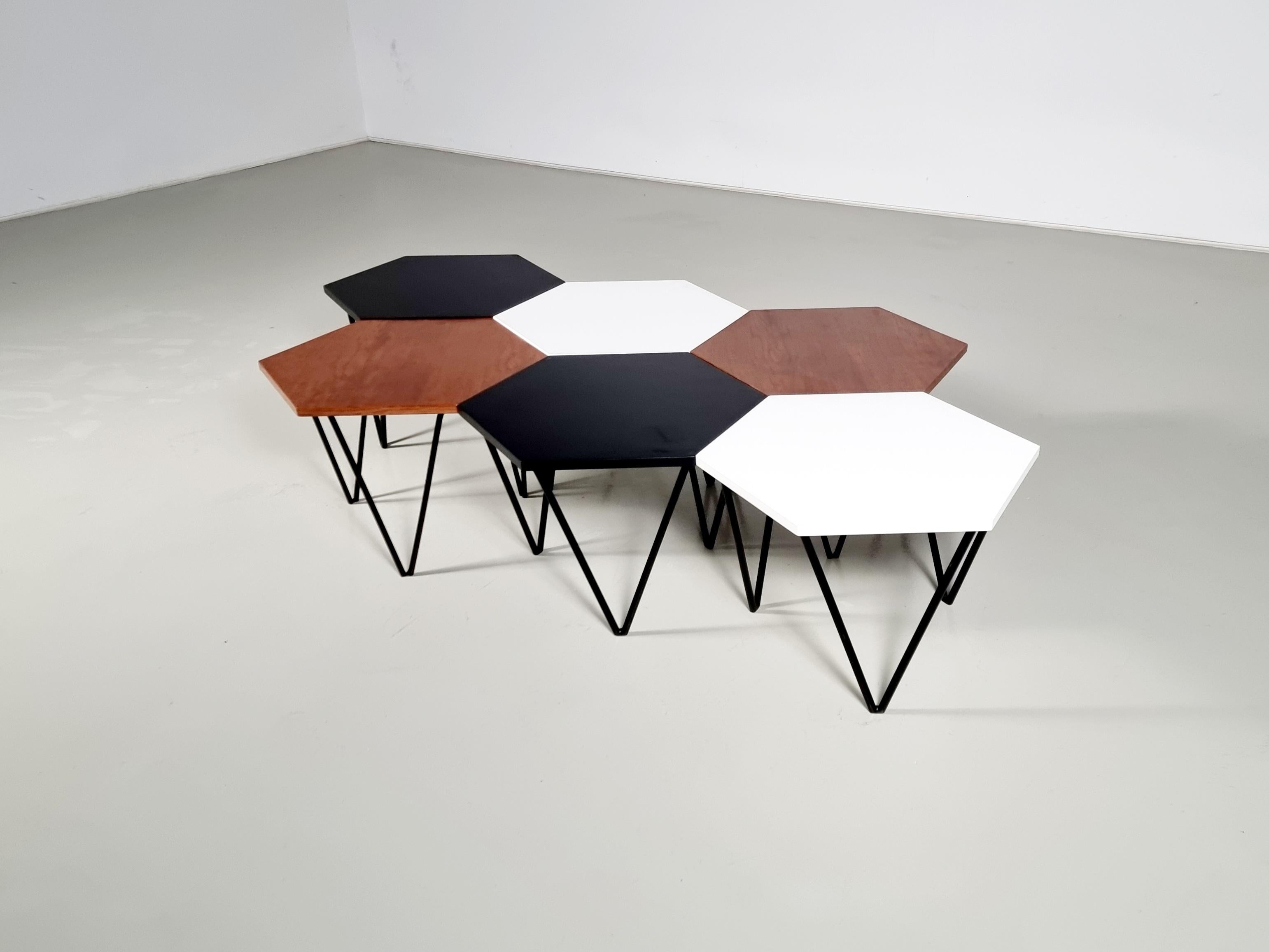 Rare set of 6 hexagonal coffee tables designed by the great designer Isa Bergamo for Gio Ponti's production in the 1950s. With the original labels.
The tables have a very elegant and durable black iron frame. The supporting legs are 3 and are