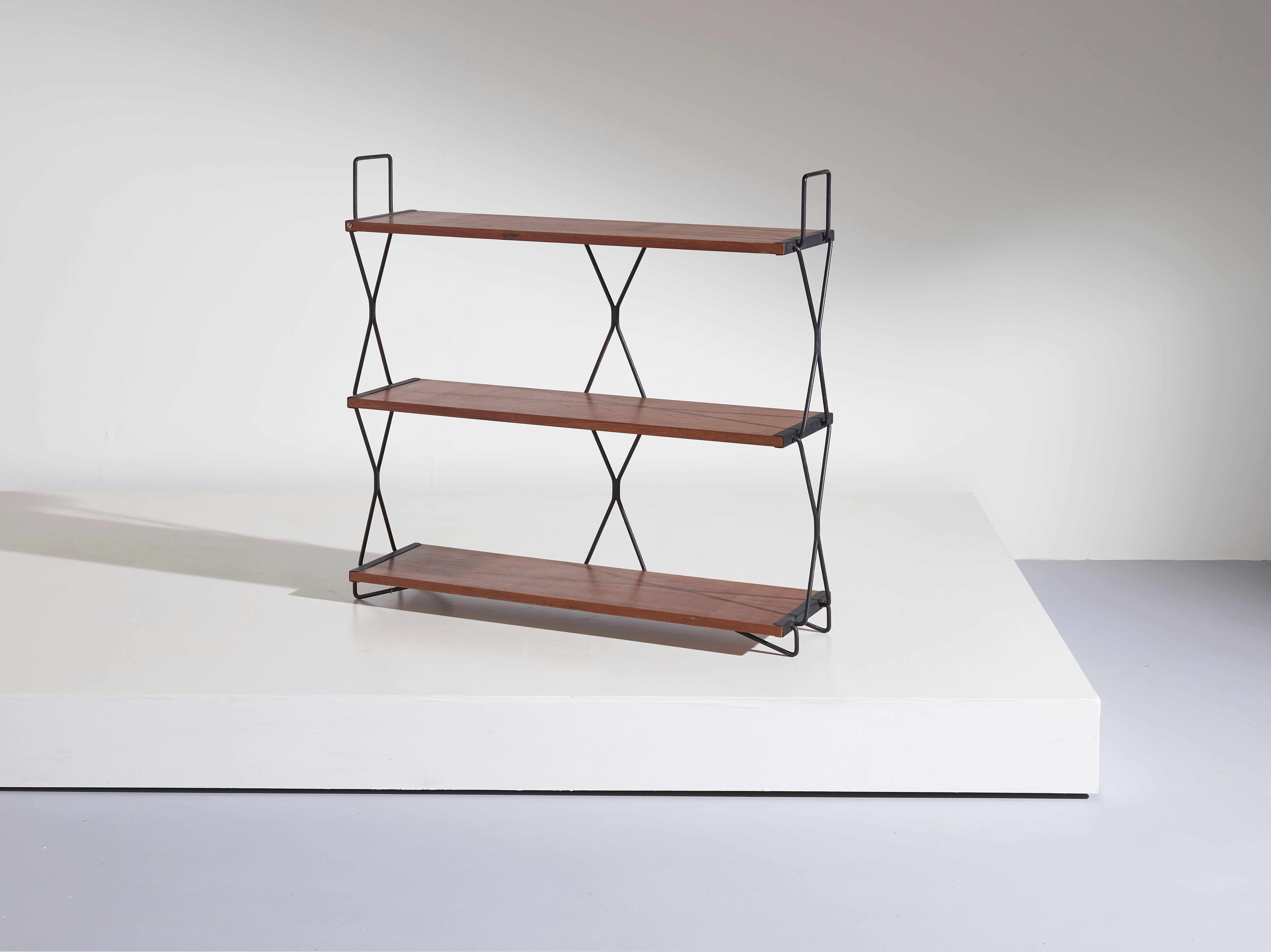 A bookshelf made by Isa Bergamo during the 1950’s with a linear and functional design. 
Made in teak and black painted iron its style and measures perfectly fits modern home environments.

Dimensions: 24.5 x 94 x 86 cm [DxWxH]

Condition: Wear
