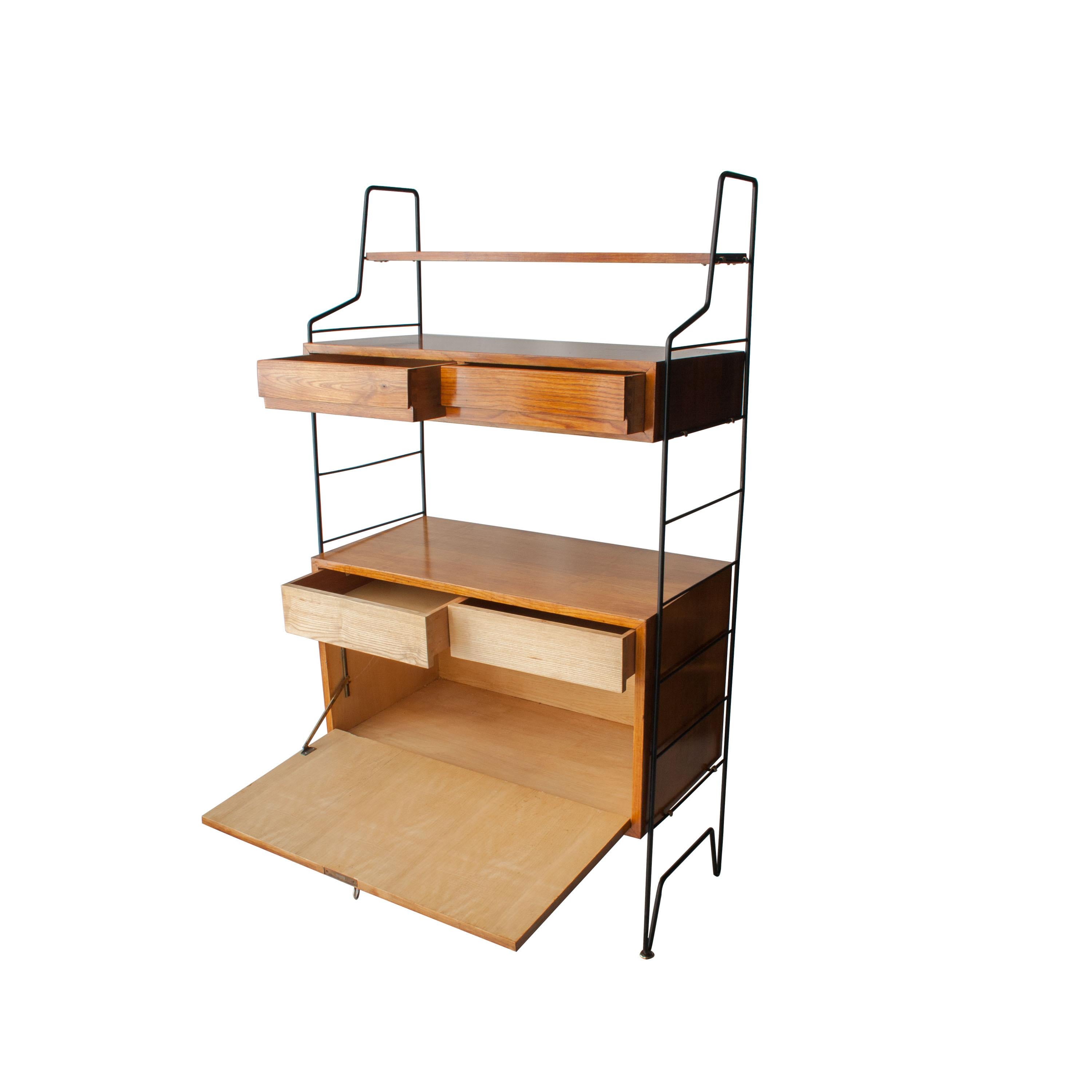 Shelving designed by Isa Bergamo. Metal structure with 3 modules, shelves, drawers and a hinged door.