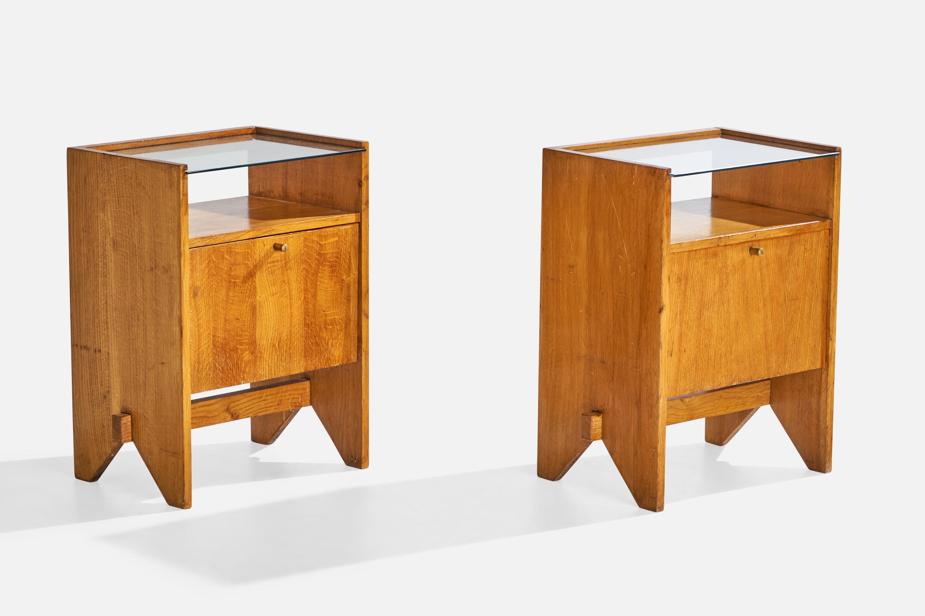 A pair of wood, glass and brass nightstands designed and produced by ISA Bergamo, Italy, c. 1950s.

