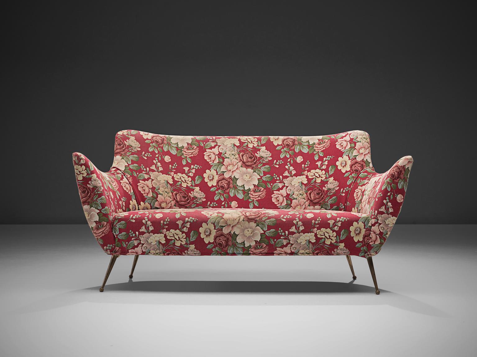 ISA Bergamo, pink red floral Italian sofa, Italy, 1950s.

This sofa is an iconic example of Italian design from the 1950s. Organic and sculptural, this two-seat sofa is anything but minimalistic. Equipped with the original stiletto brass feet