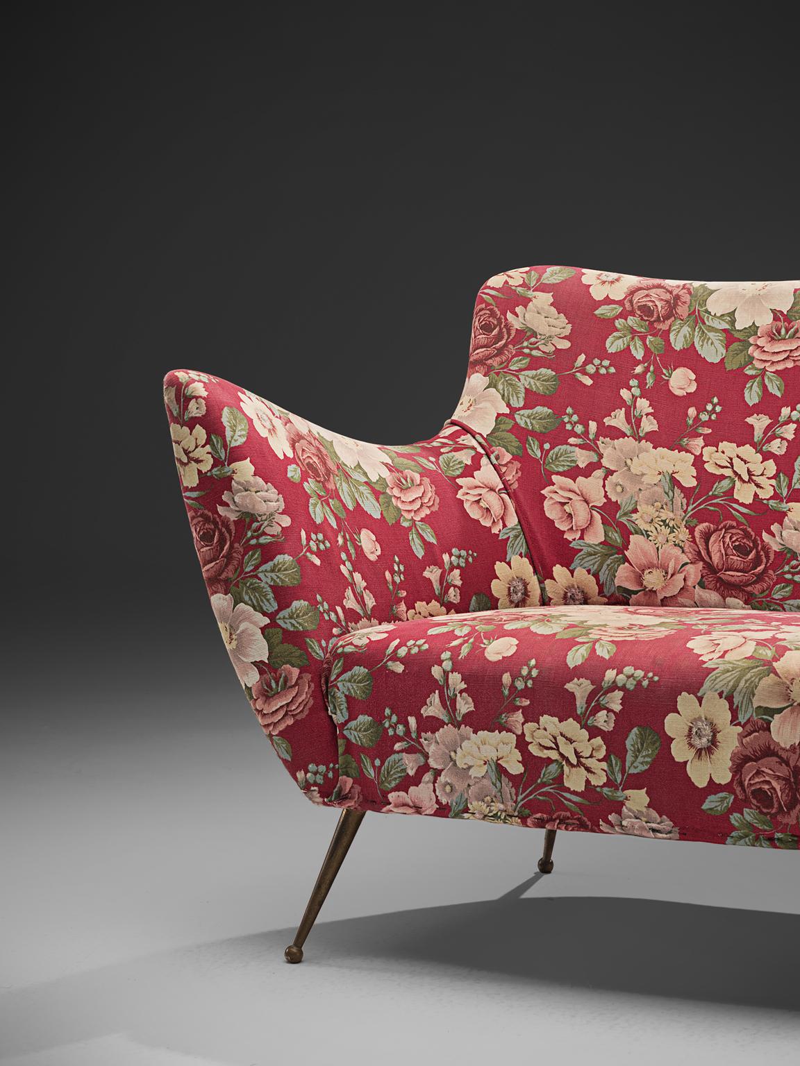 red floral sofas