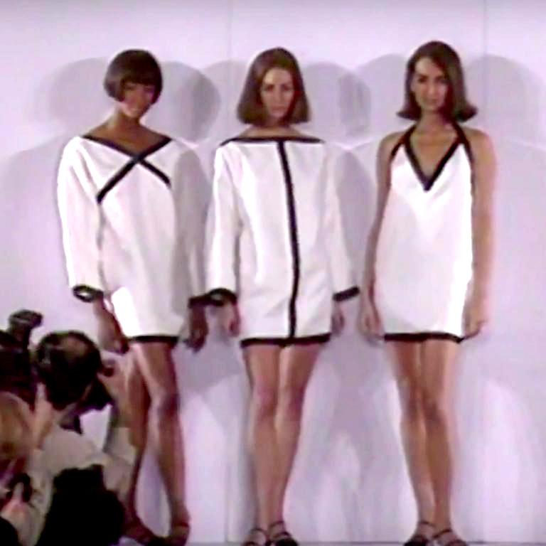This vintage Isaac Mizrahi white linen dress was featured on the Spring Summer 1990 runway. We have been fortunate to have had all three of the variations of this dress over the years! We love the clever way the black silk ribbon trim creates an 