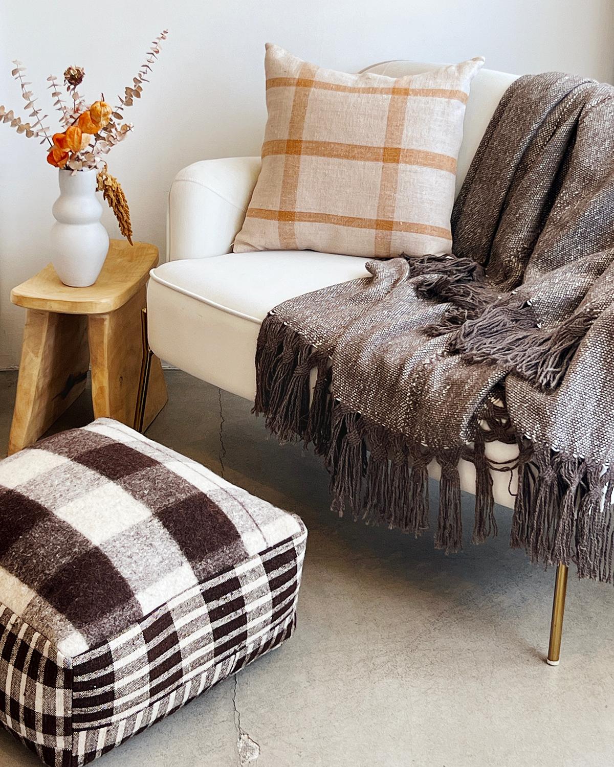 A handsome ottoman to put your feet up

A hundred years ago these fabrics used to be cereal sacks in Northern Portugal. Now they get rediscovered and transformed into a rare collectible. This wool Isabel Checkered Square Pouf Ottoman is a unique and