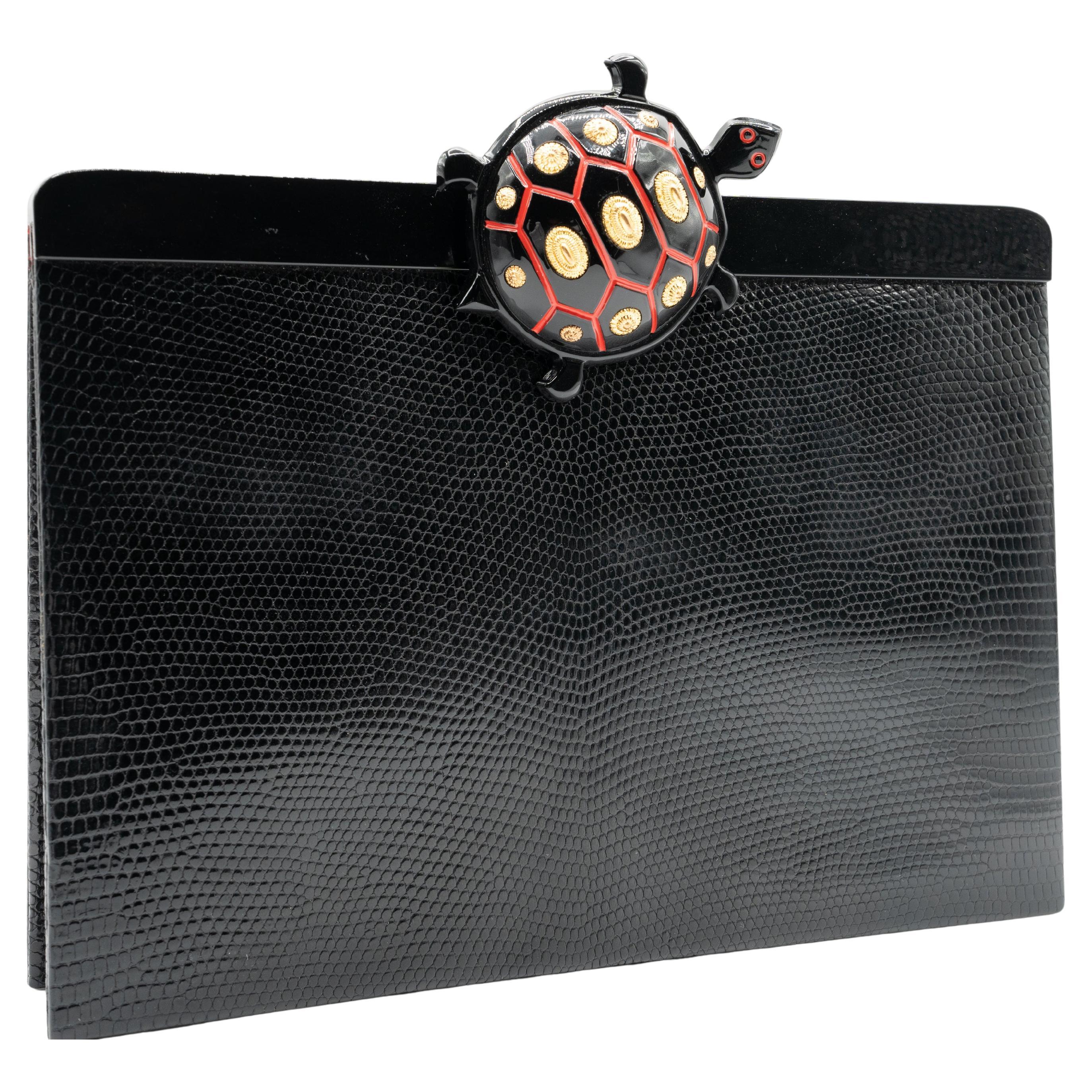 Isabel Canovas Schwarze Eidechse-Clutch mit Schildkrötenverschluss im Angebot