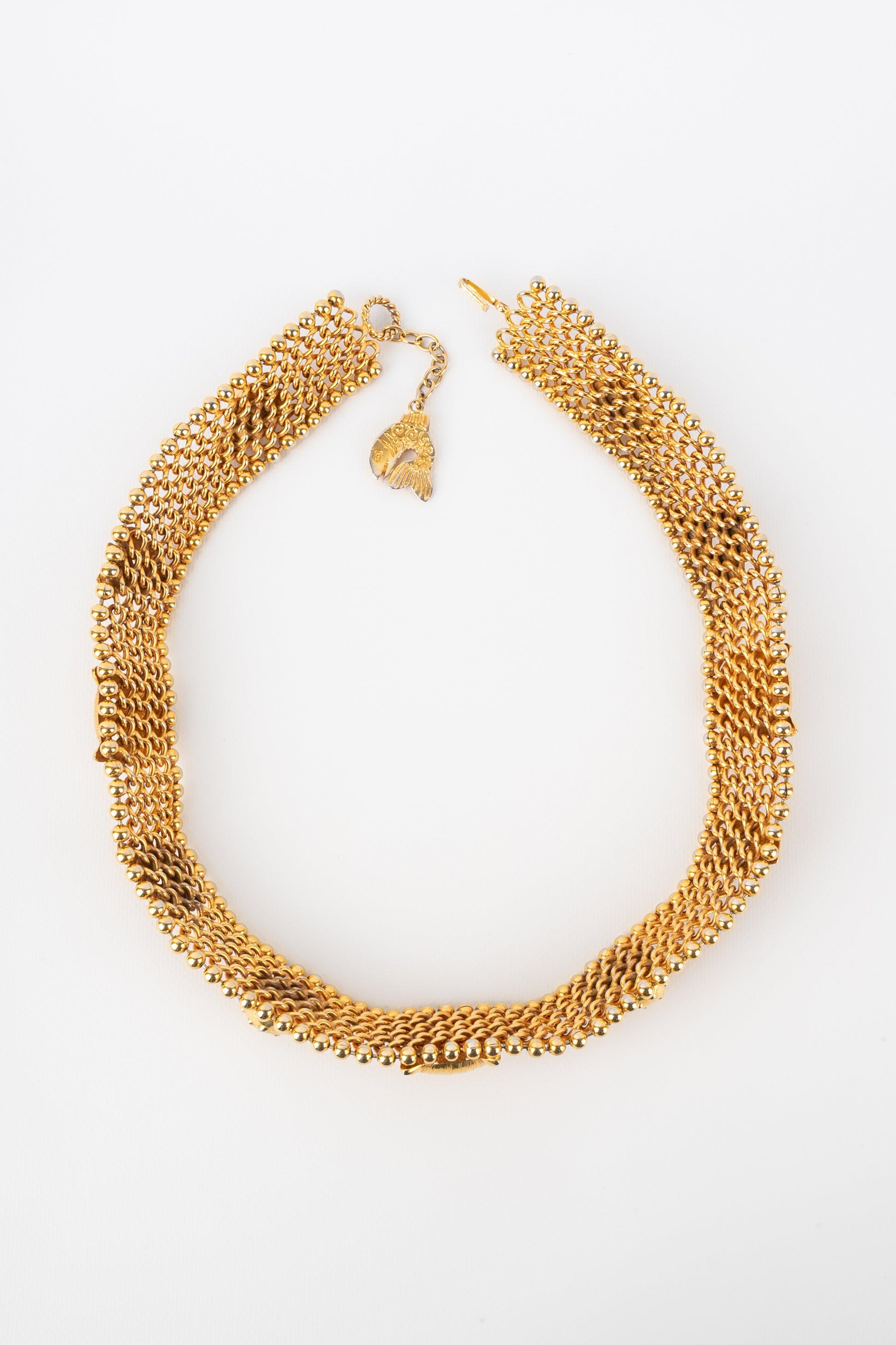Isabel Canovas - Golden metal chain belt topped with animal shapes.

Additional information:
Condition: Good condition
Dimensions: Length: from 72 cm to 77 cm

Seller Reference: ACC168