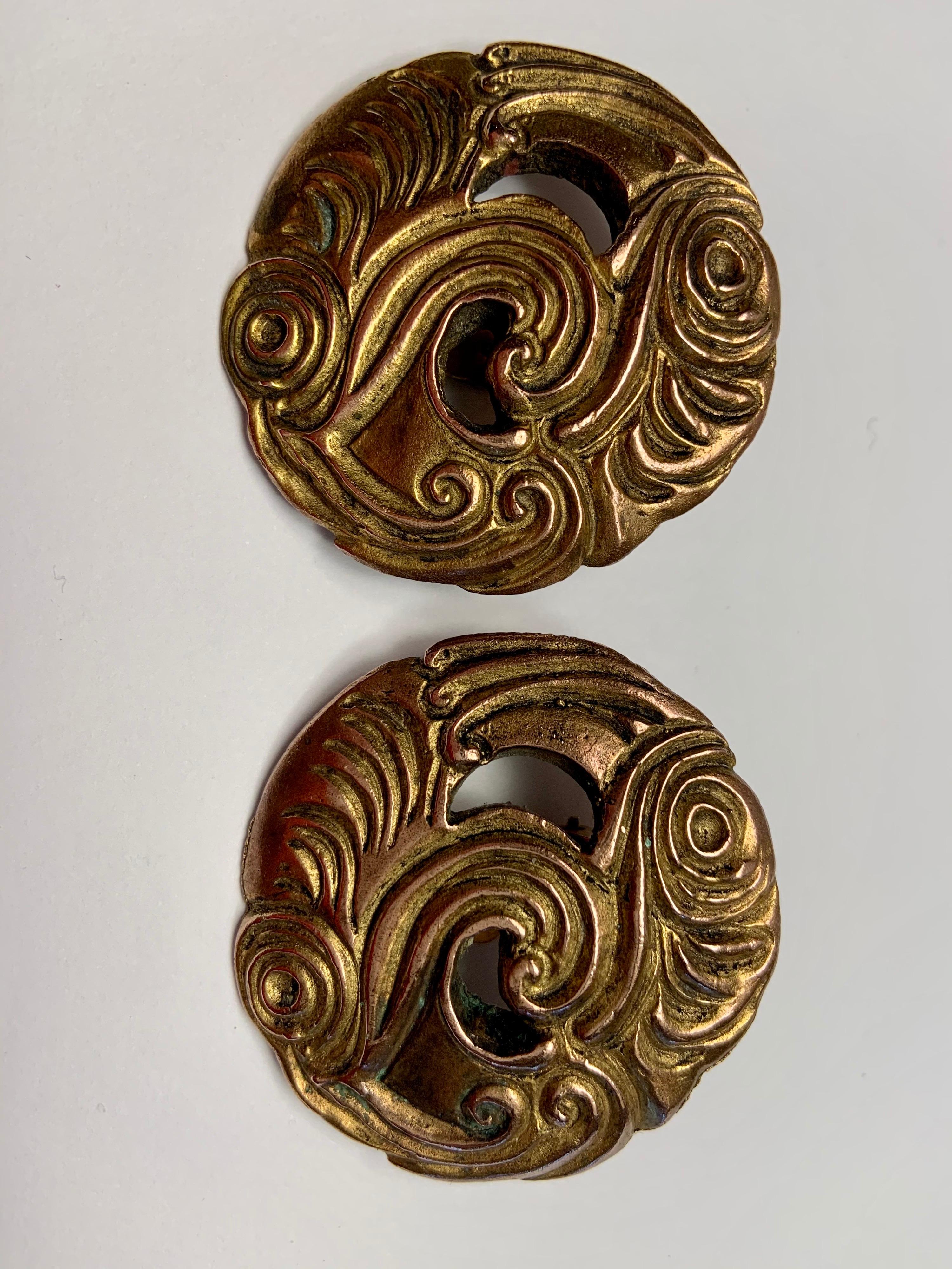 Isabel Canovas designed a large round earring with a swirling, wave like design and two open sections in gilt bronze. The earrings are signed on the back and they are in excellent condition.
Measurements:  Height 1.5