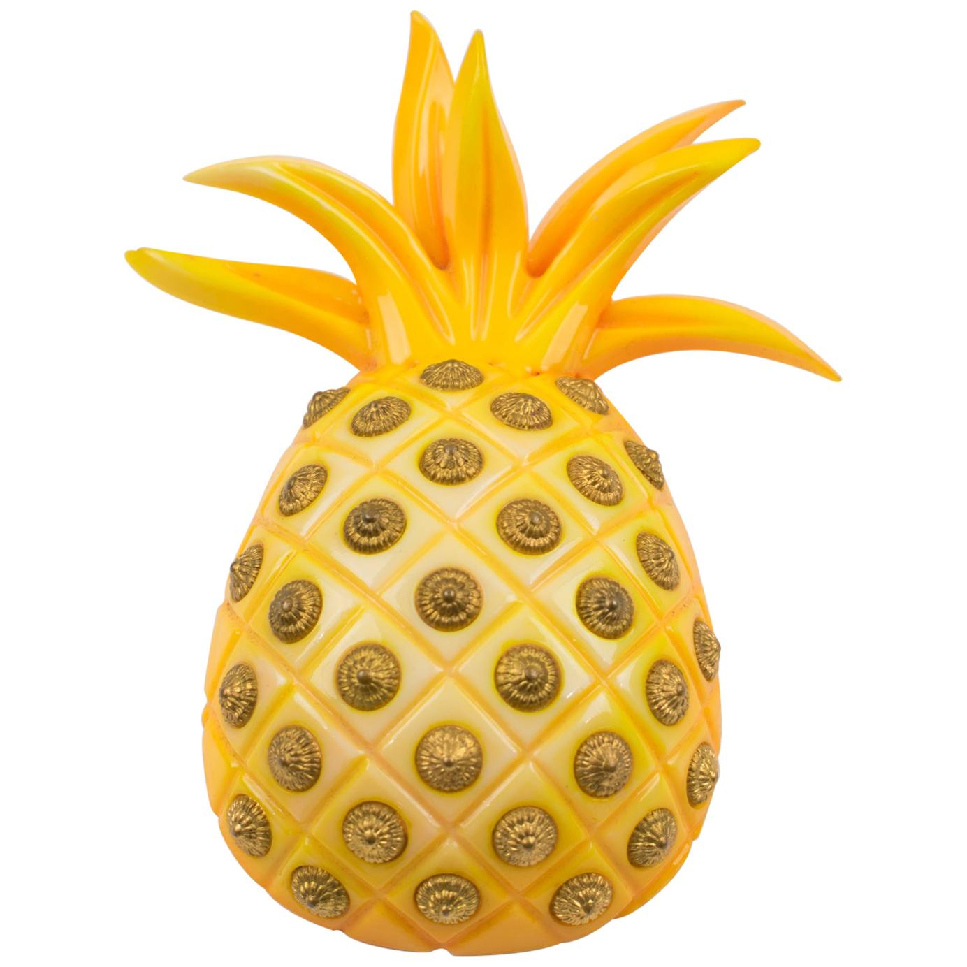 Elevate your private collection with this exceptional 1980s acrylic Lucite brooch, a rare masterpiece from renowned French designer Isabel Canovas. Crafted in France, this striking piece features an important,  bold, dimensional pineapple-carved