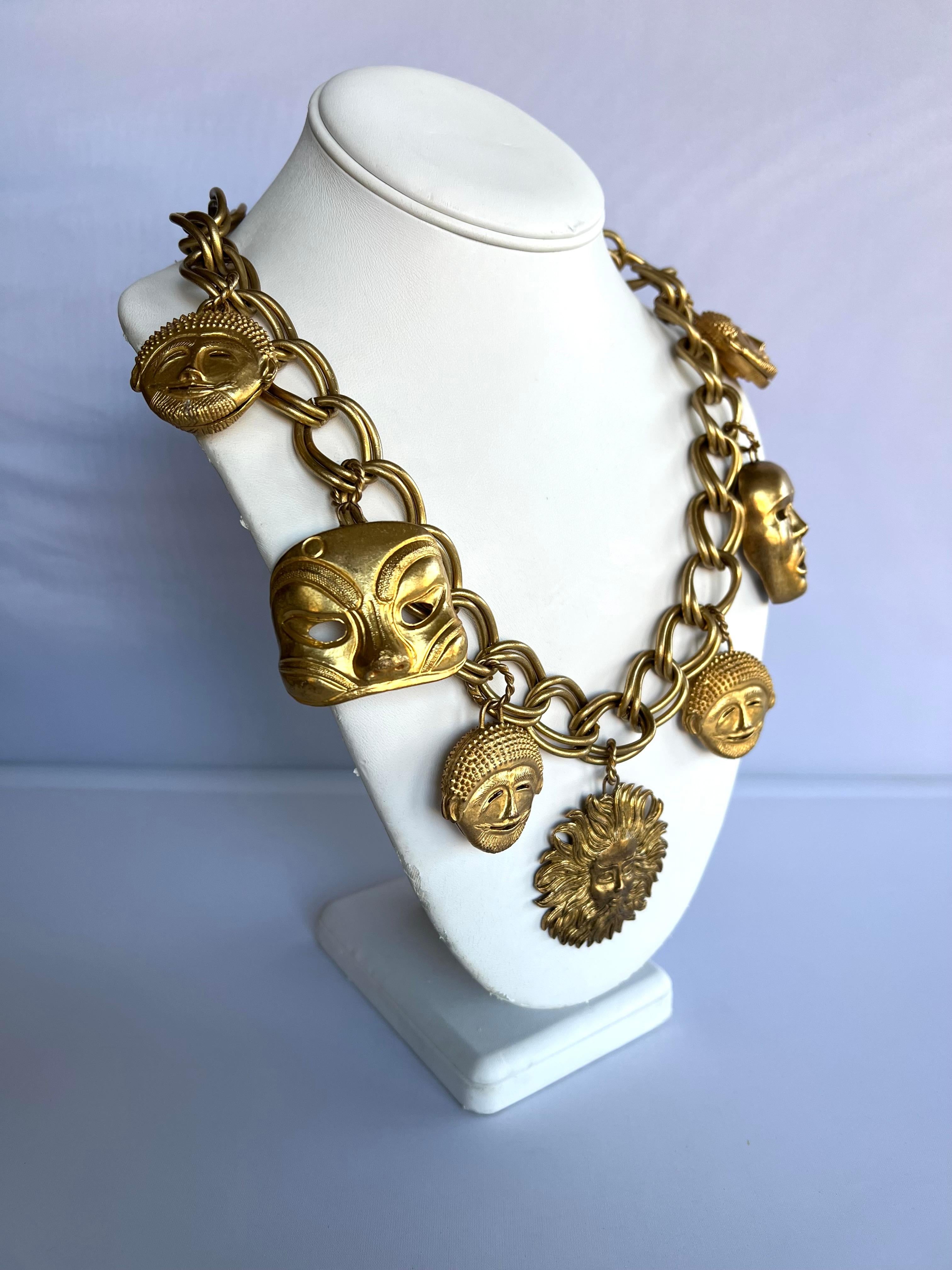 Scarce vintage chunky charm necklace by Isabel Canovas - comprised of gilt metal chain and detailed masks, made in Paris France. 

The matching earrings are listed on a separate listing.